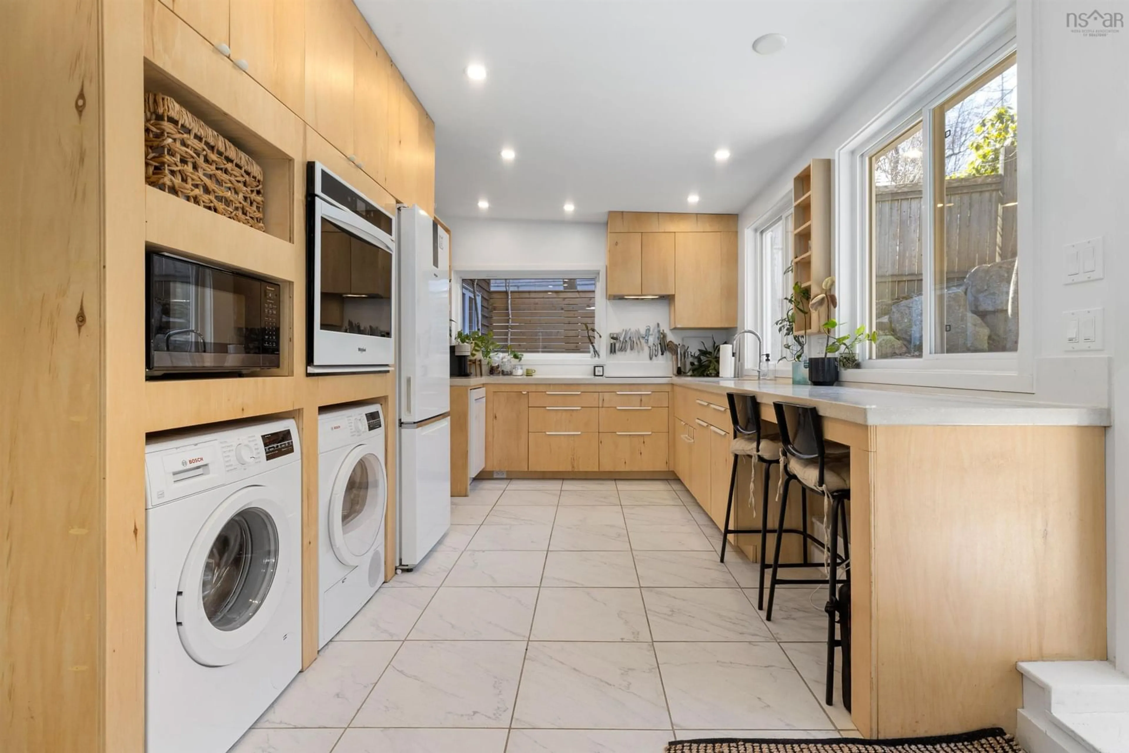 Kitchen with laundary machines, ceramic/tile floor for 3166 Purcells Cove Rd, Halifax Nova Scotia B3P 2G5