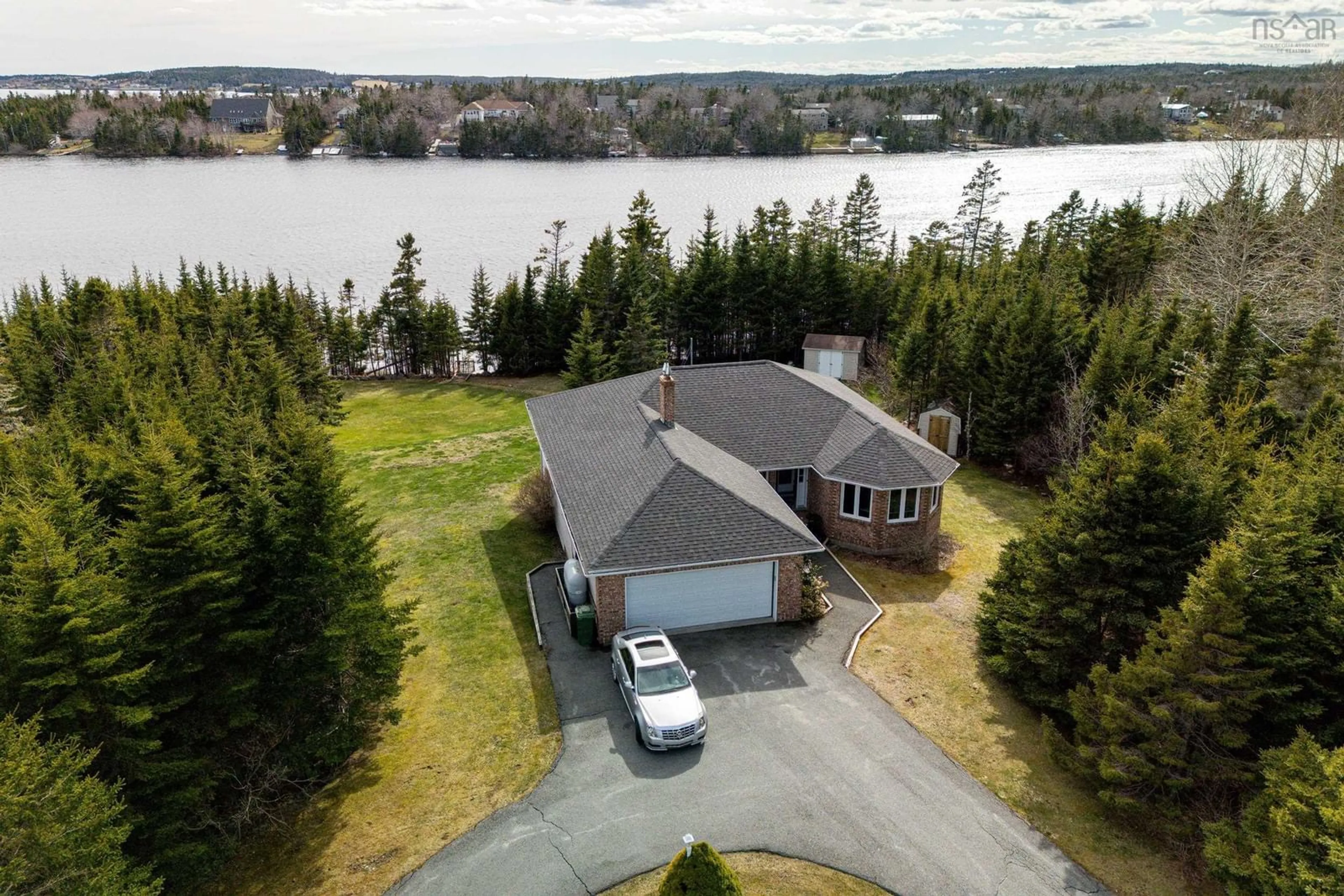 A pic from outside/outdoor area/front of a property/back of a property/a pic from drone, water/lake/river/ocean view for 287 Greenough Dr, West Porters Lake Nova Scotia B3E 1M8
