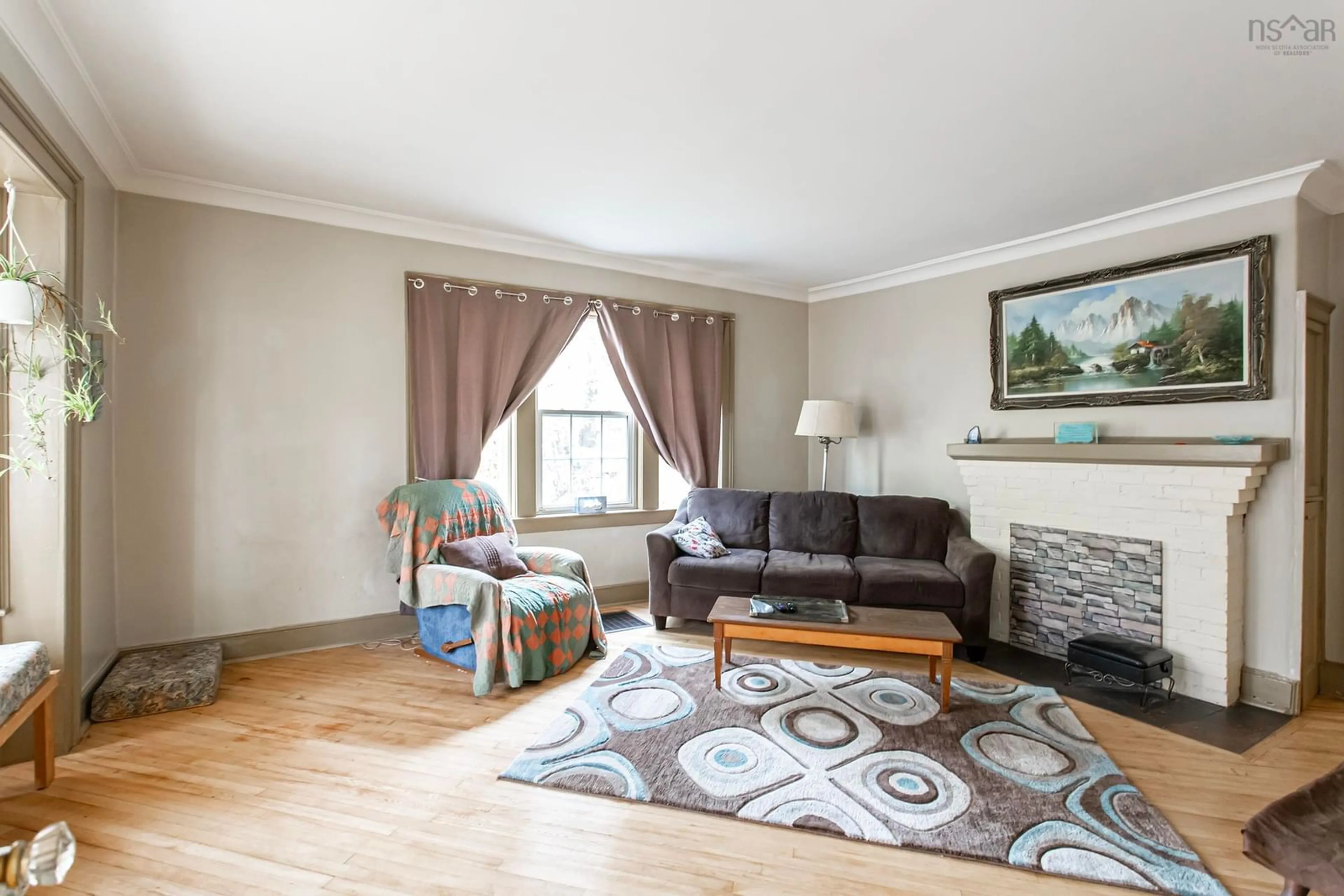 Living room with furniture, wood/laminate floor for 9717 Highway 10, Nictaux Nova Scotia B0S 1P0