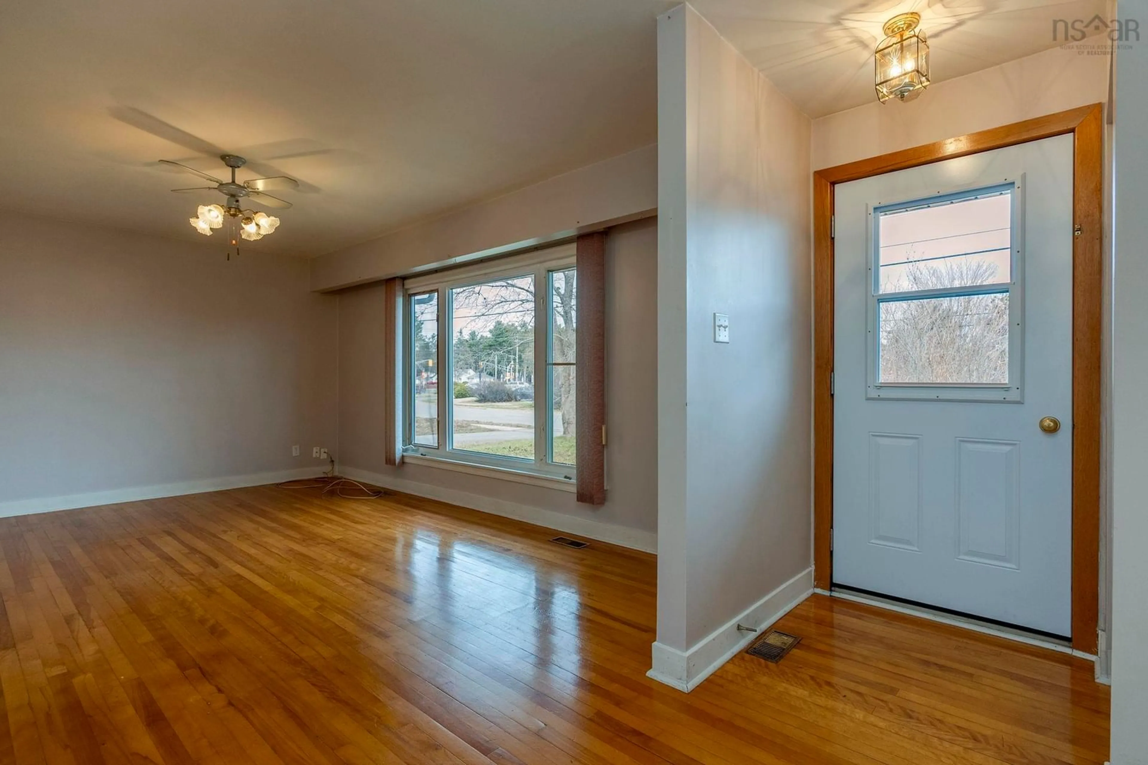 Living room with furniture, wood/laminate floor for 997 Argus Drive, Greenwood Nova Scotia B0P 1R0