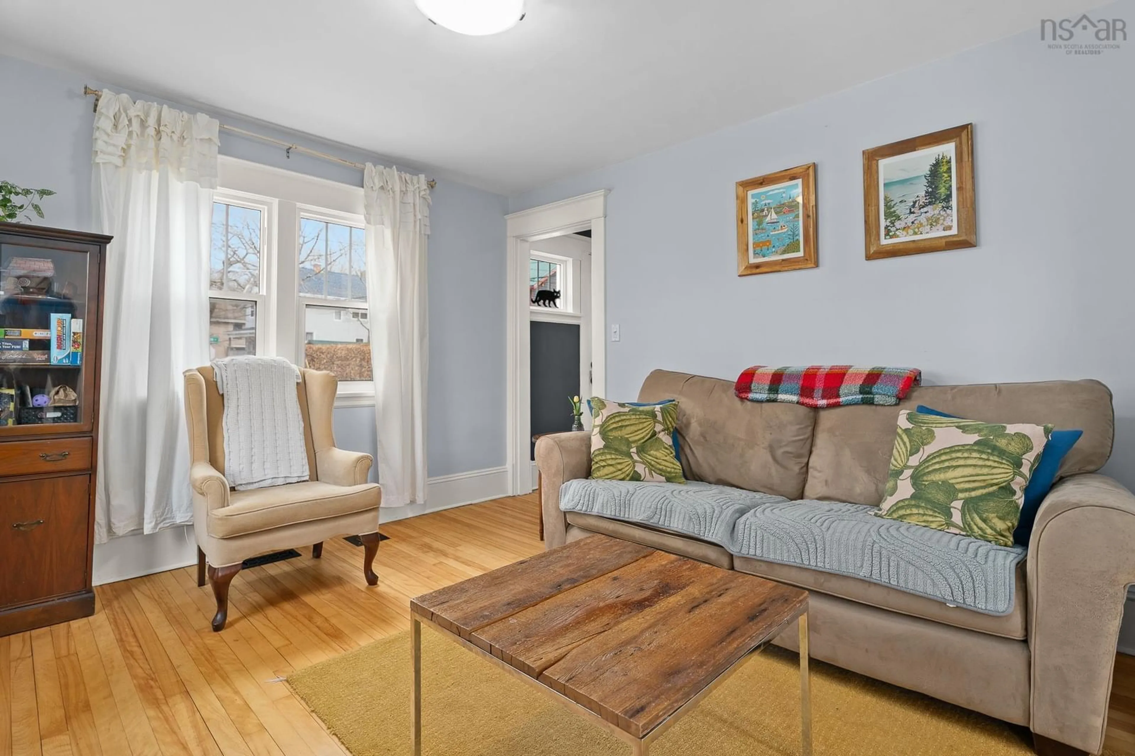 Living room with furniture, wood/laminate floor for 38 Jamieson St, Dartmouth Nova Scotia B3A 3C1
