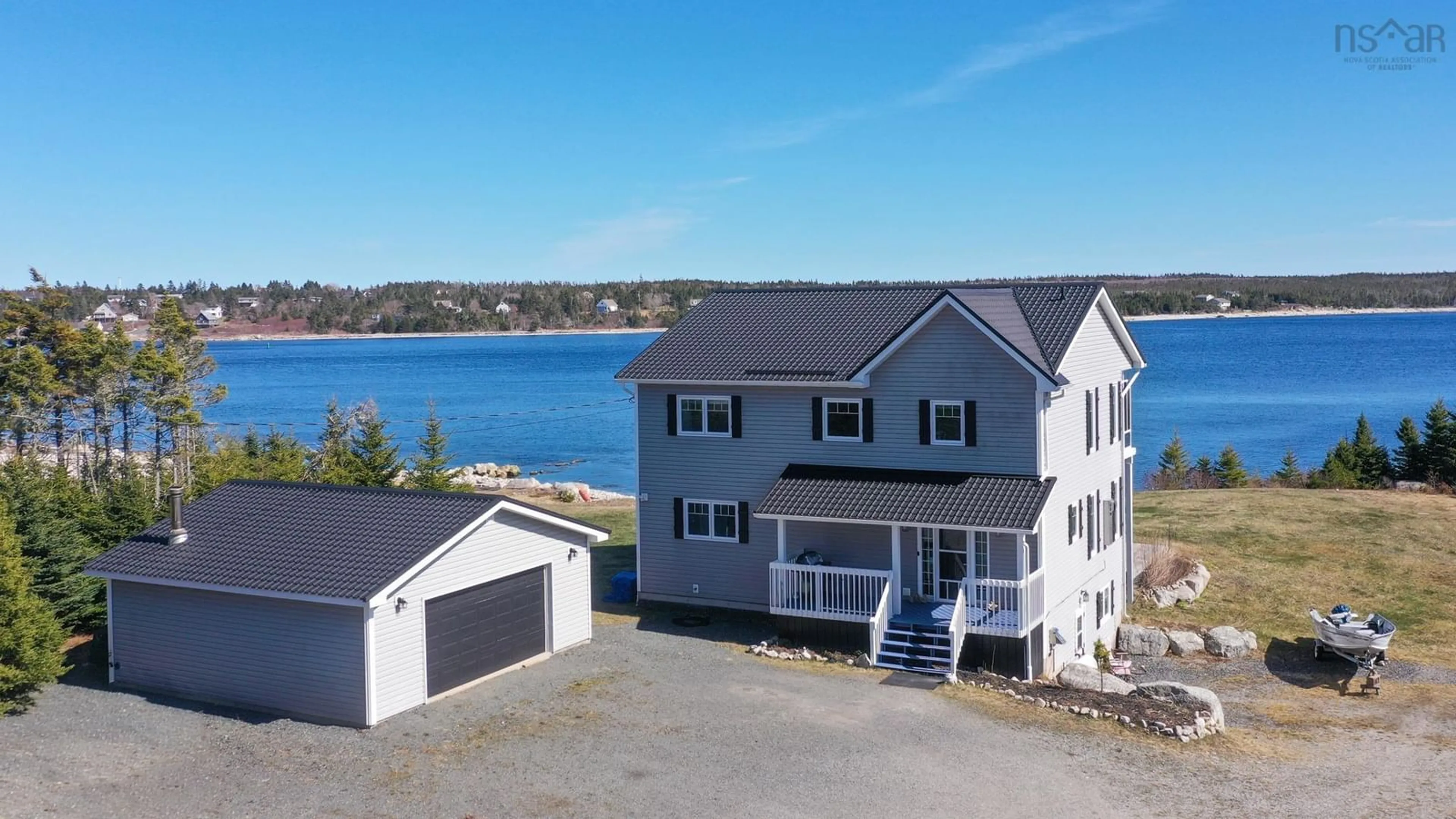 A pic from outside/outdoor area/front of a property/back of a property/a pic from drone, water/lake/river/ocean view for 102 Oceantide Lane, West Pennant Nova Scotia B3V 0E9