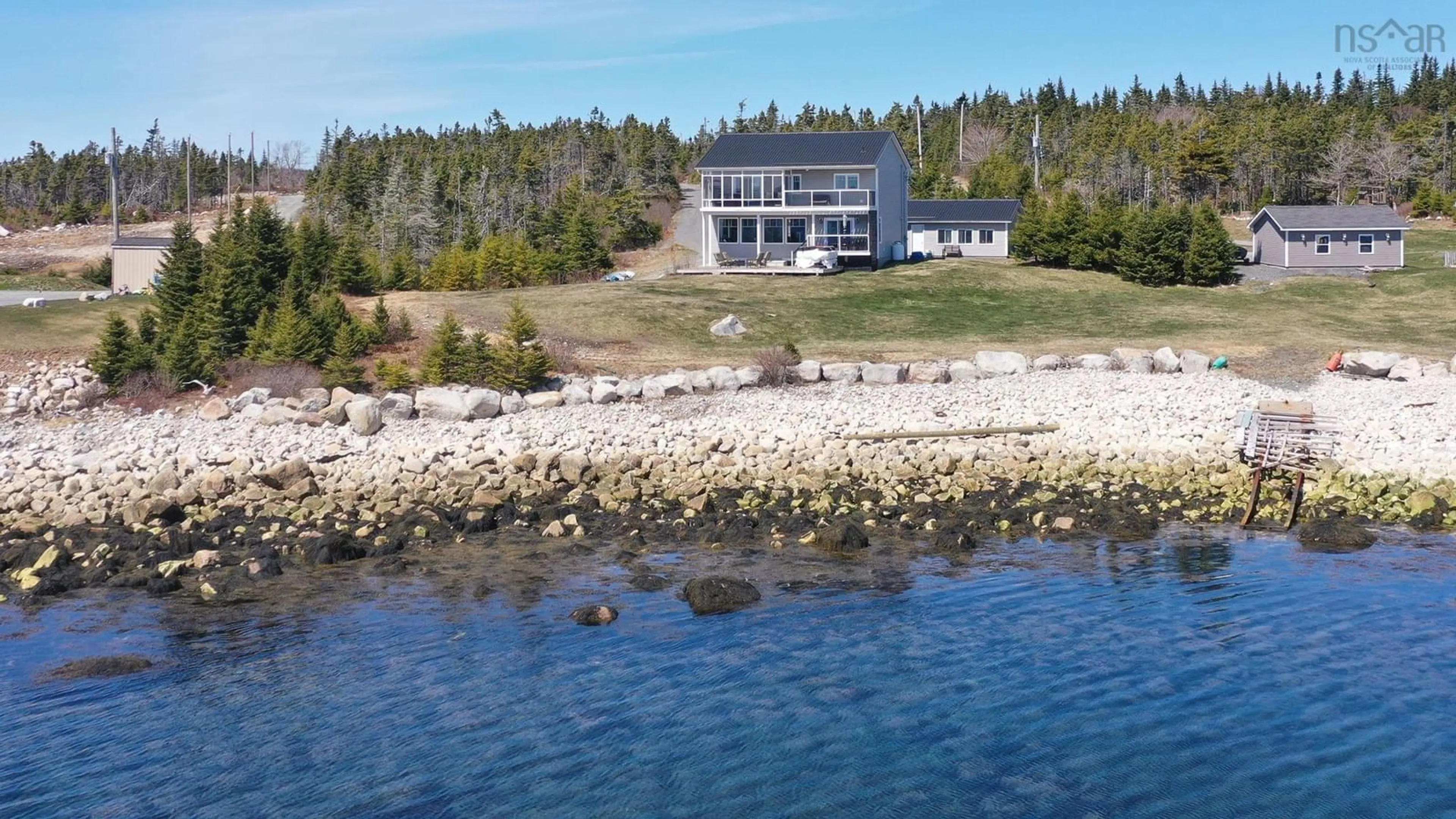 A pic from outside/outdoor area/front of a property/back of a property/a pic from drone, water/lake/river/ocean view for 102 Oceantide Lane, West Pennant Nova Scotia B3V 0E9