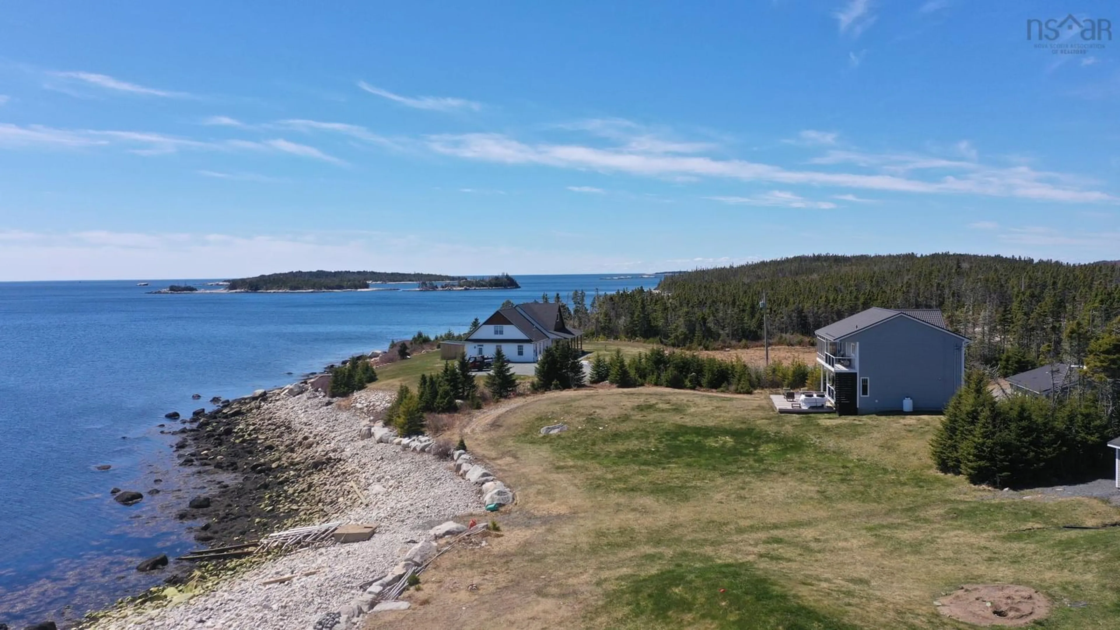 A pic from outside/outdoor area/front of a property/back of a property/a pic from drone, water/lake/river/ocean view for 102 Oceantide Lane, West Pennant Nova Scotia B3V 0E9