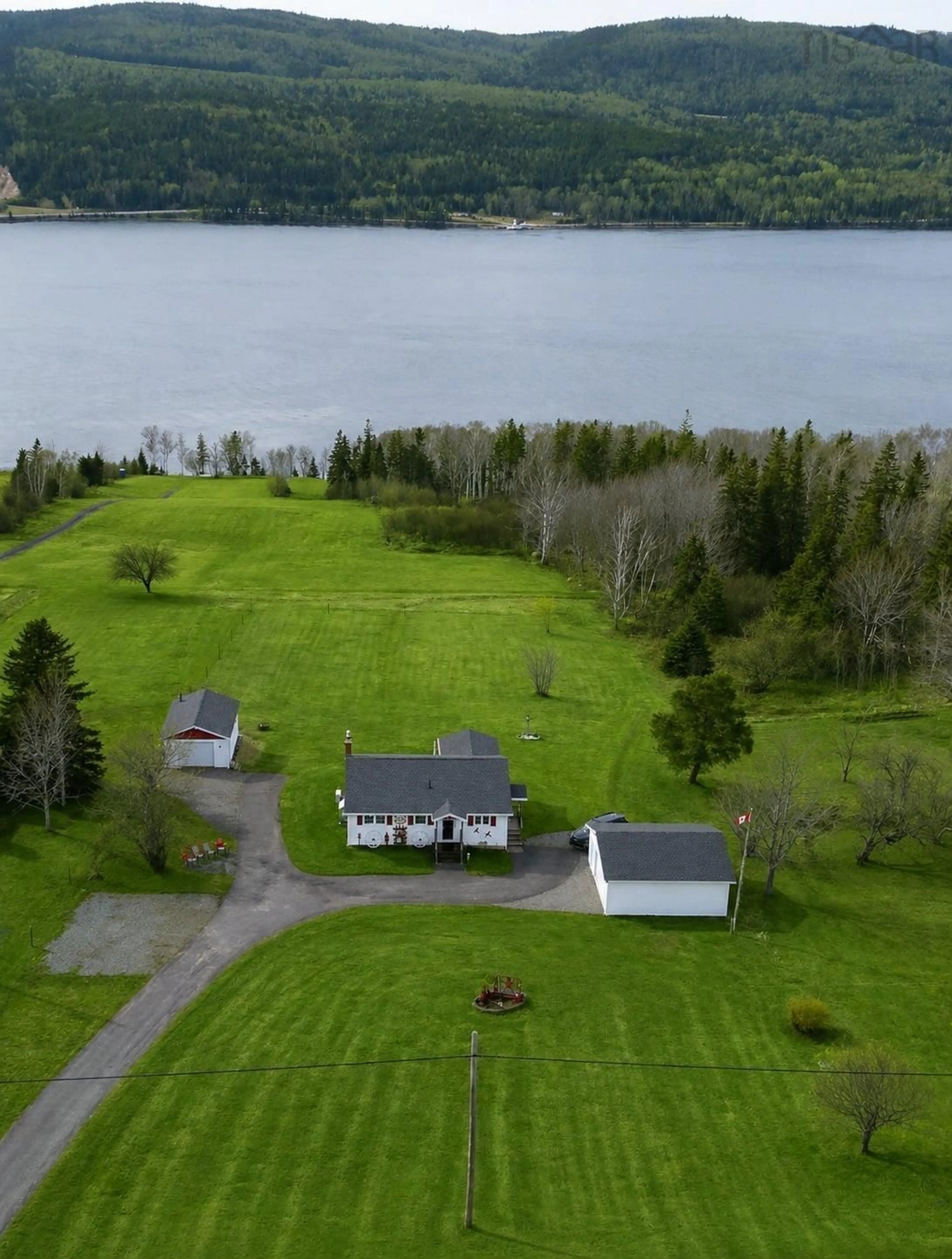 A pic from outside/outdoor area/front of a property/back of a property/a pic from drone, water/lake/river/ocean view for 868 Highway 105, Boularderie East Nova Scotia B1X 1J5