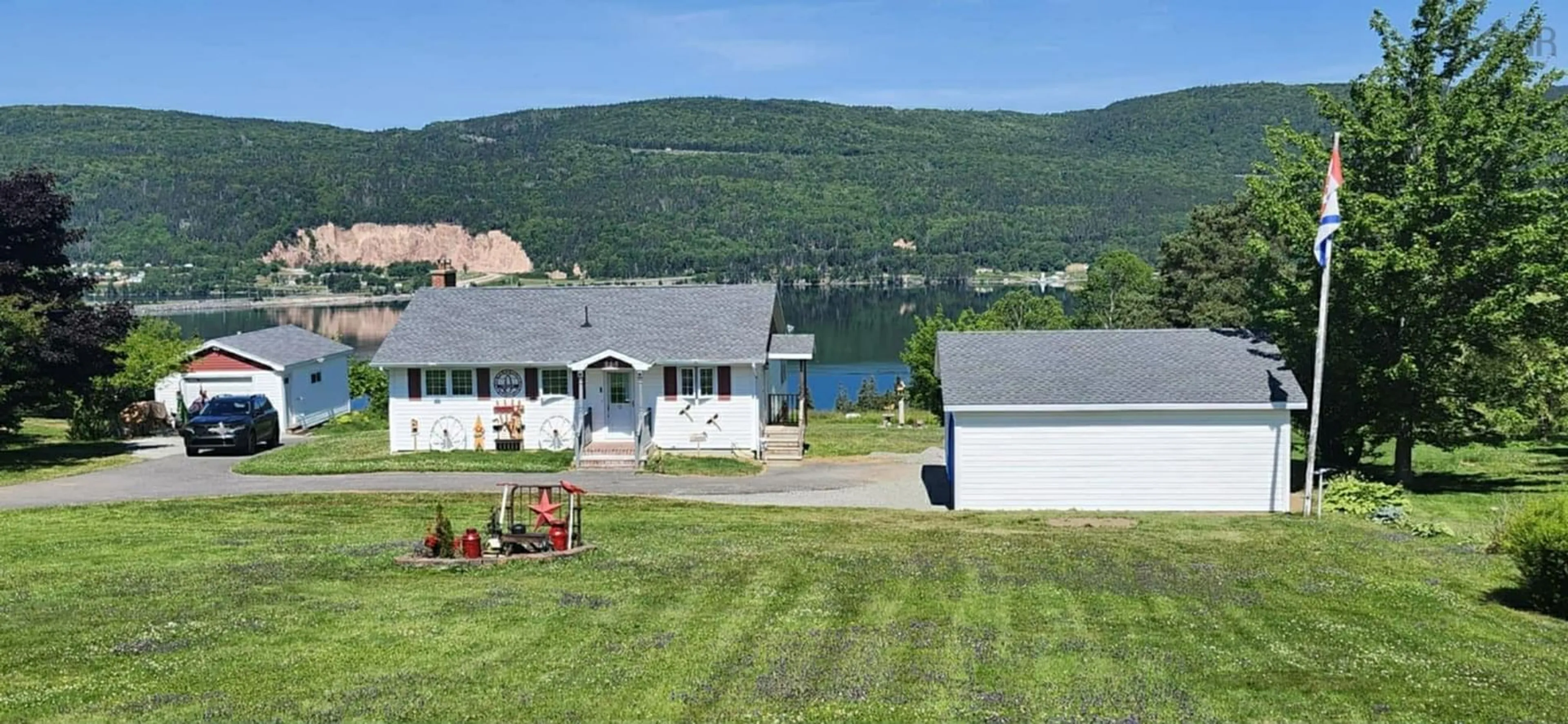 A pic from outside/outdoor area/front of a property/back of a property/a pic from drone, water/lake/river/ocean view for 868 Highway 105, Boularderie East Nova Scotia B1X 1J5