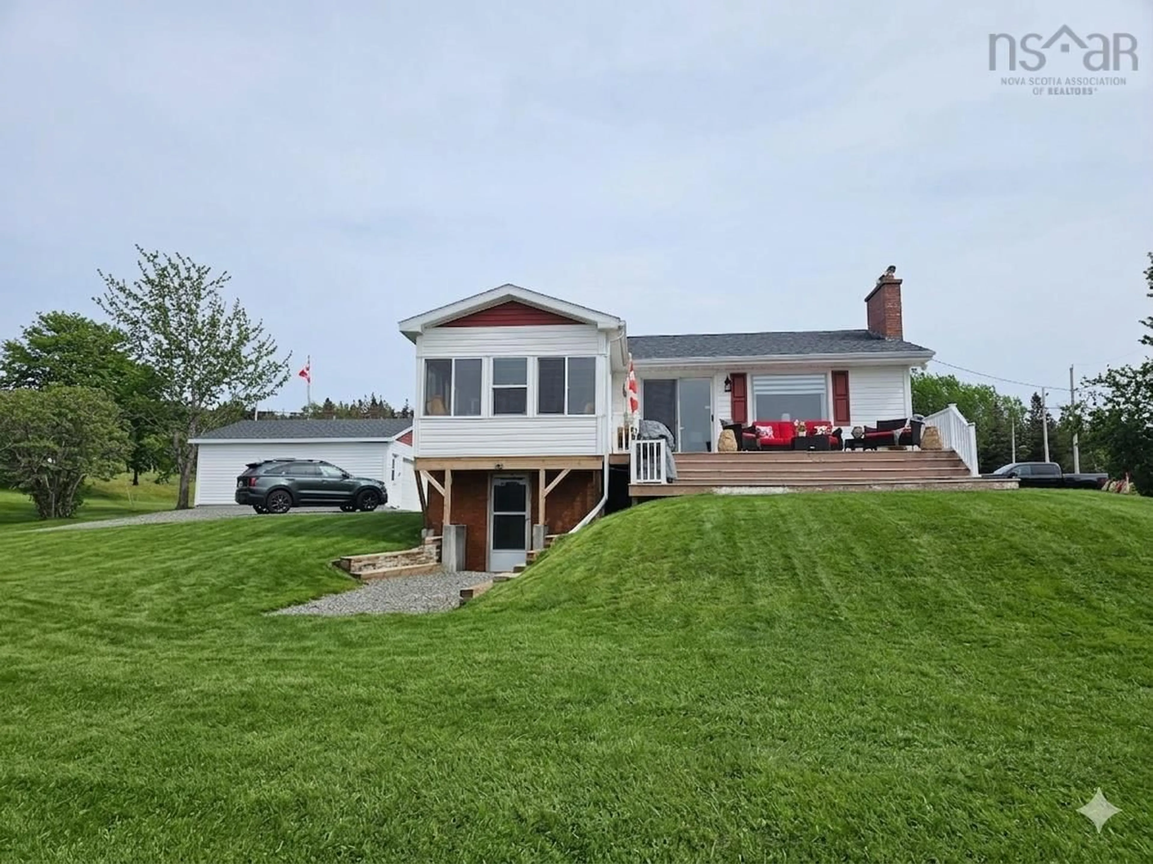 A pic from outside/outdoor area/front of a property/back of a property/a pic from drone, water/lake/river/ocean view for 868 Highway 105, Boularderie East Nova Scotia B1X 1J5