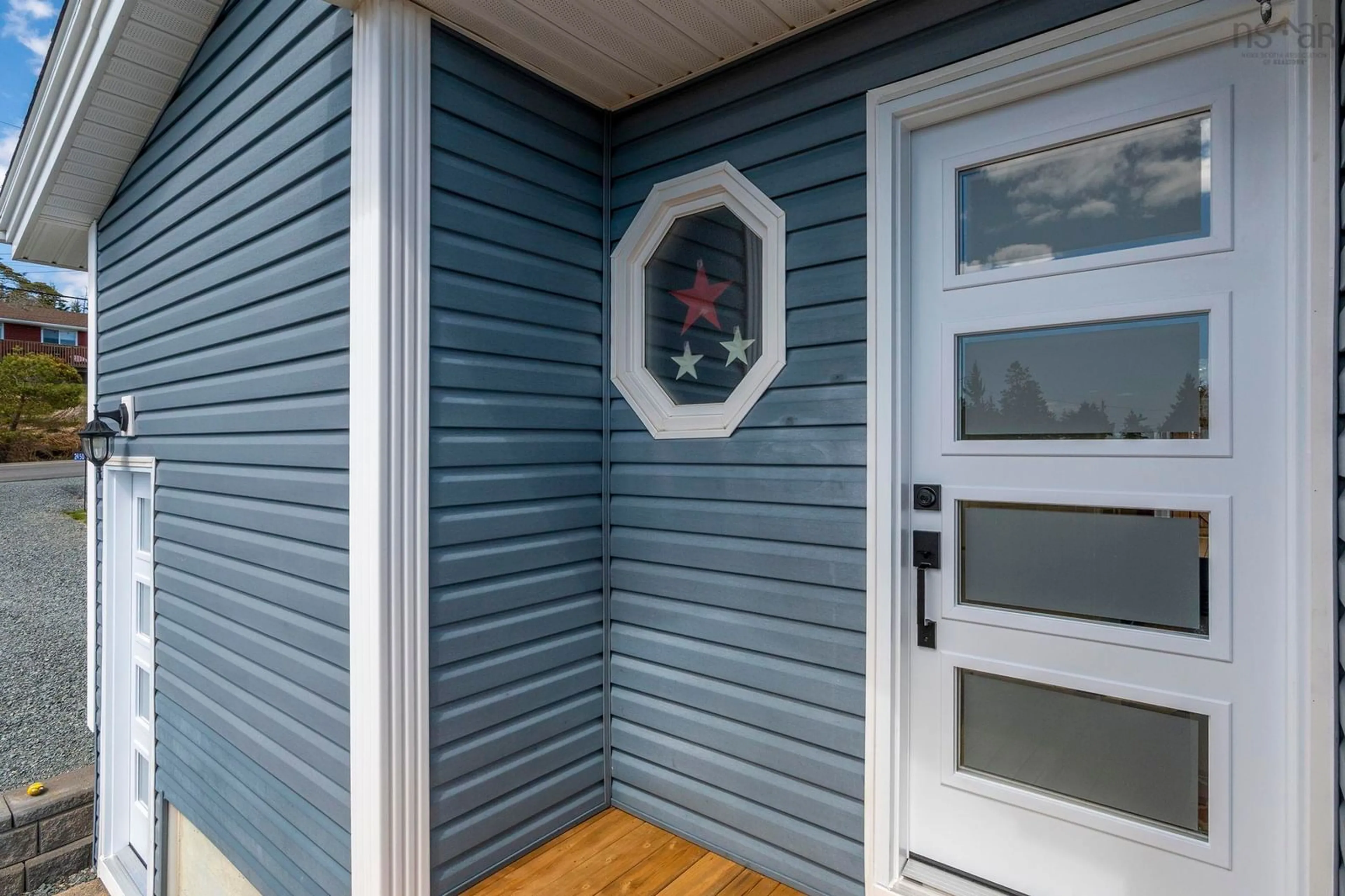 Home with vinyl exterior material, street for 2450 Crowell Rd, East Lawrencetown Nova Scotia B2Z 1P5