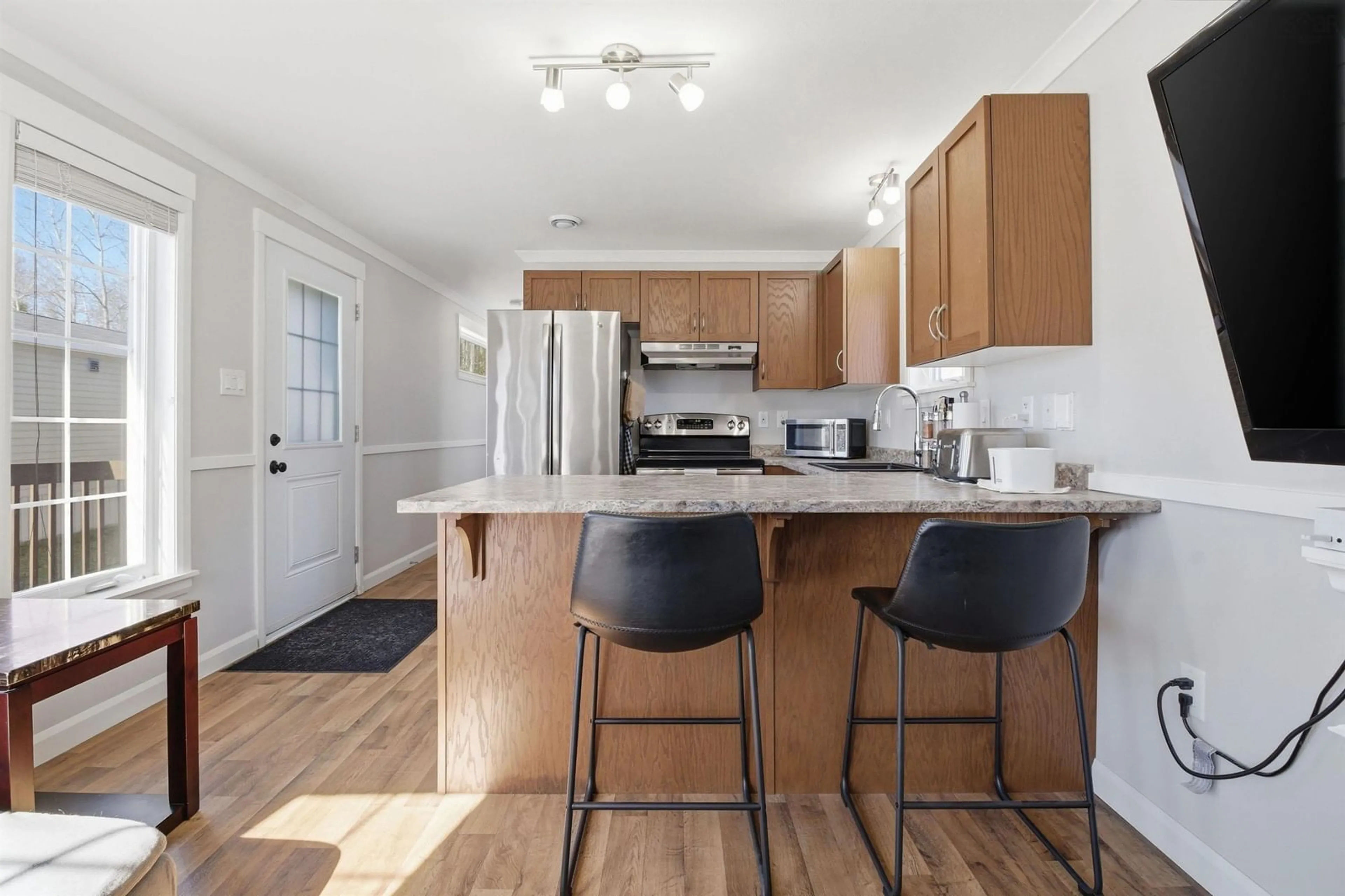 Open concept kitchen, wood/laminate floor for 1617 Frankie Dr, Beaver Bank Nova Scotia B4E 2M6