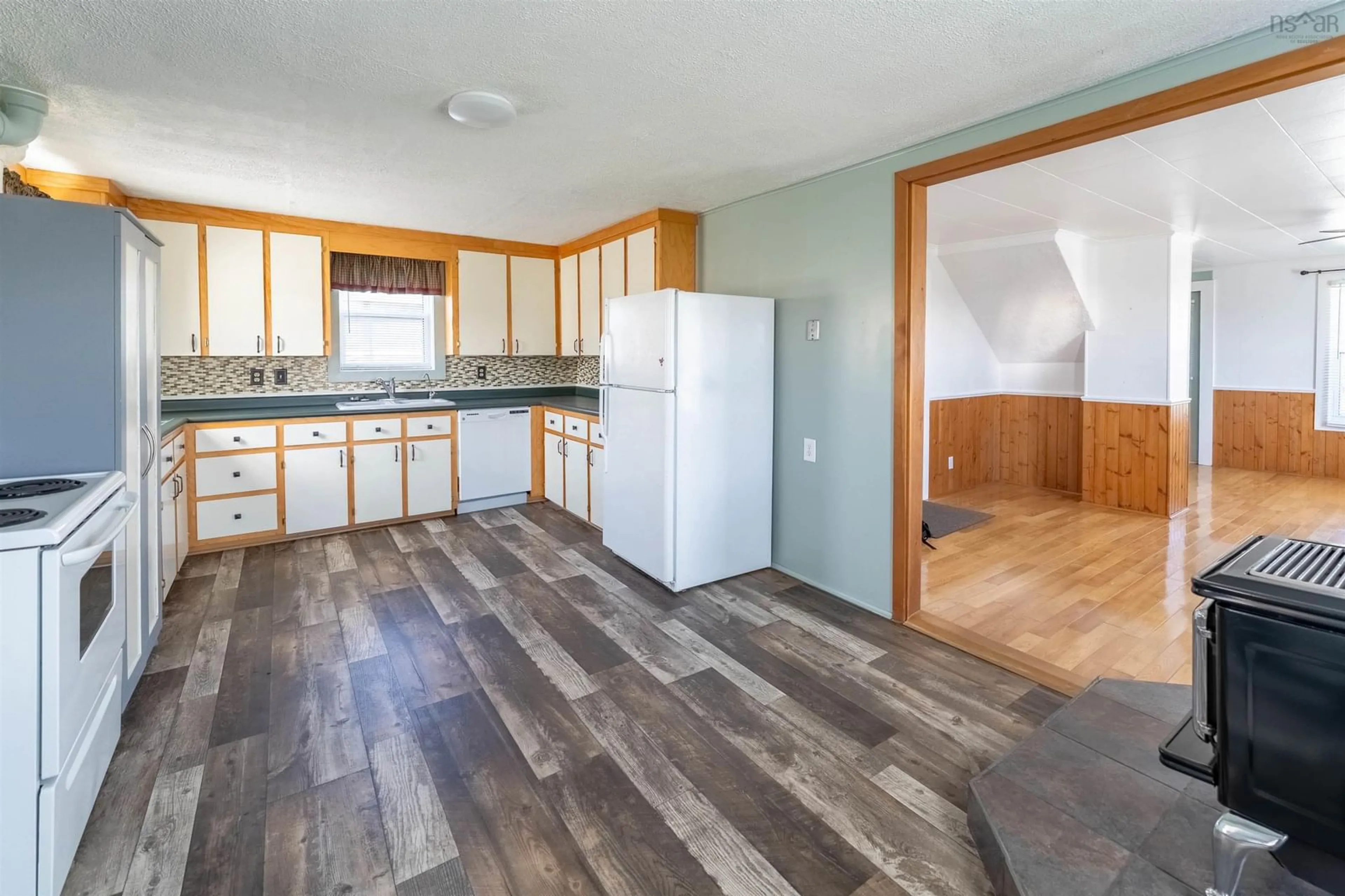 Open concept kitchen, wood/laminate floor for 83 Victoria St, Digby Nova Scotia B0V 1A0