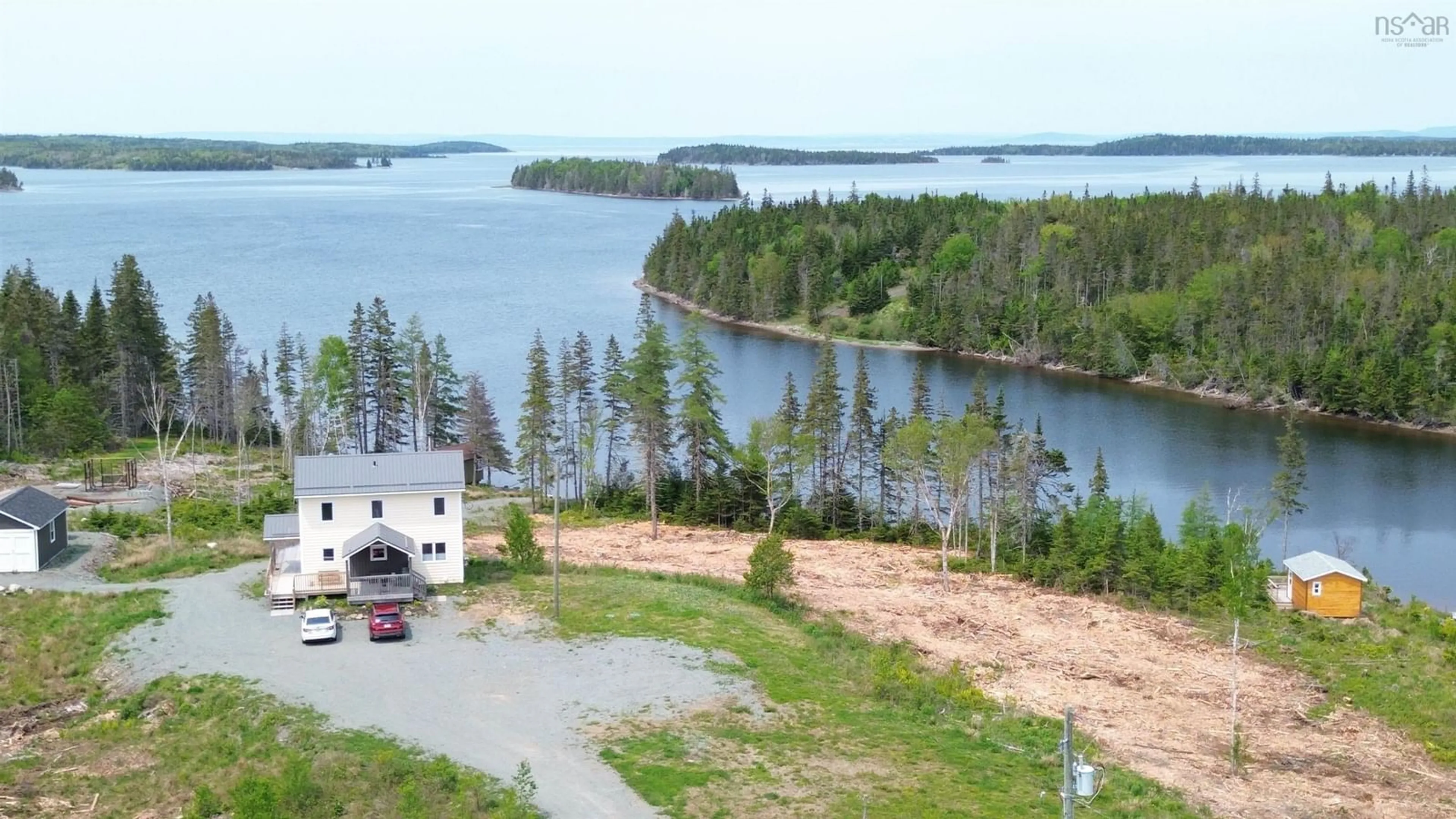 A pic from outside/outdoor area/front of a property/back of a property/a pic from drone, water/lake/river/ocean view for 1589 Corbetts Cove Rd, Barra Head Nova Scotia B0E 3B0