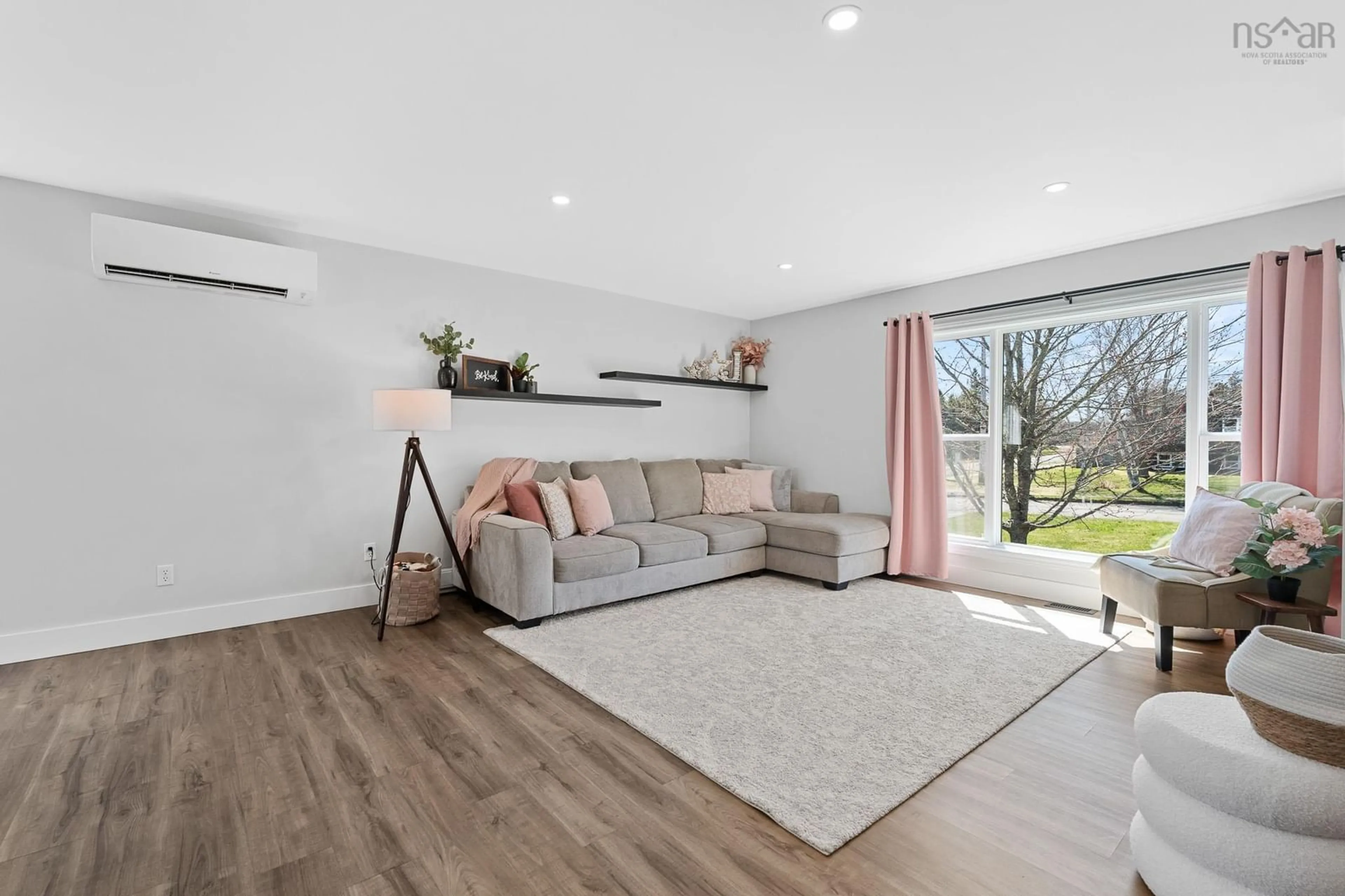 Living room with furniture, wood/laminate floor for 23 Retson Dr, Bible Hill Nova Scotia B2N 6H4