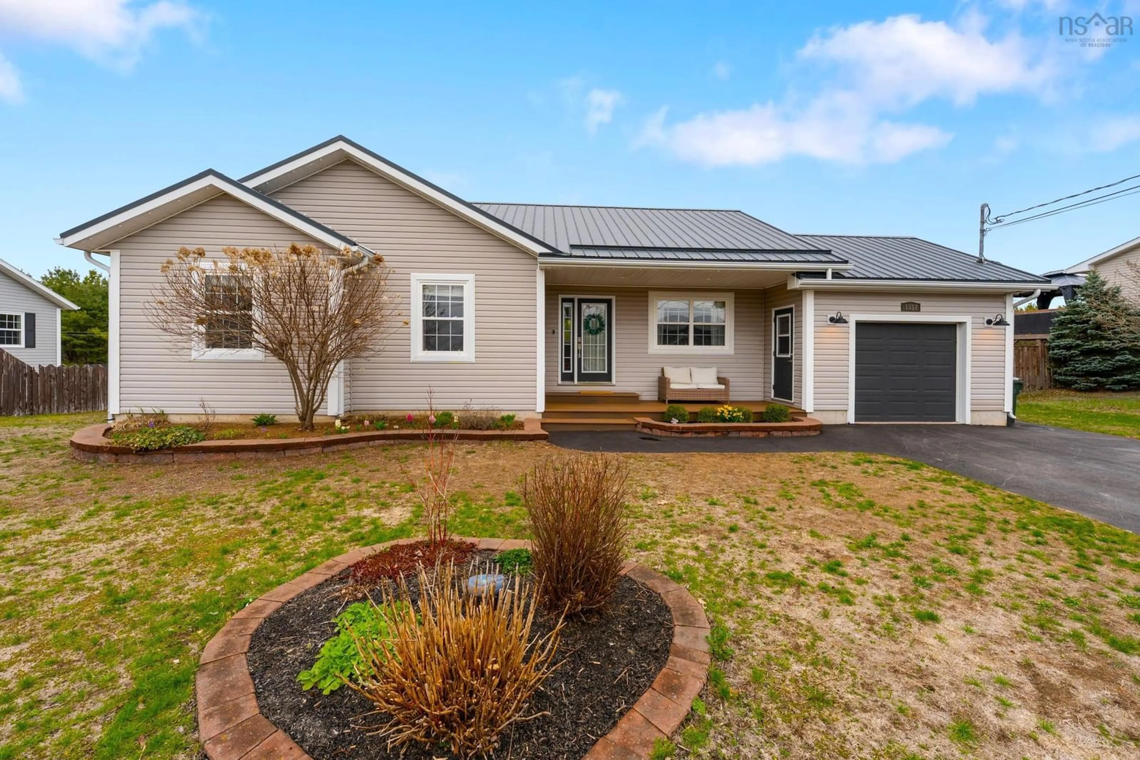 Home with vinyl exterior material, street for 1857 Acadia Dr, Kingston Nova Scotia B0P 1R0