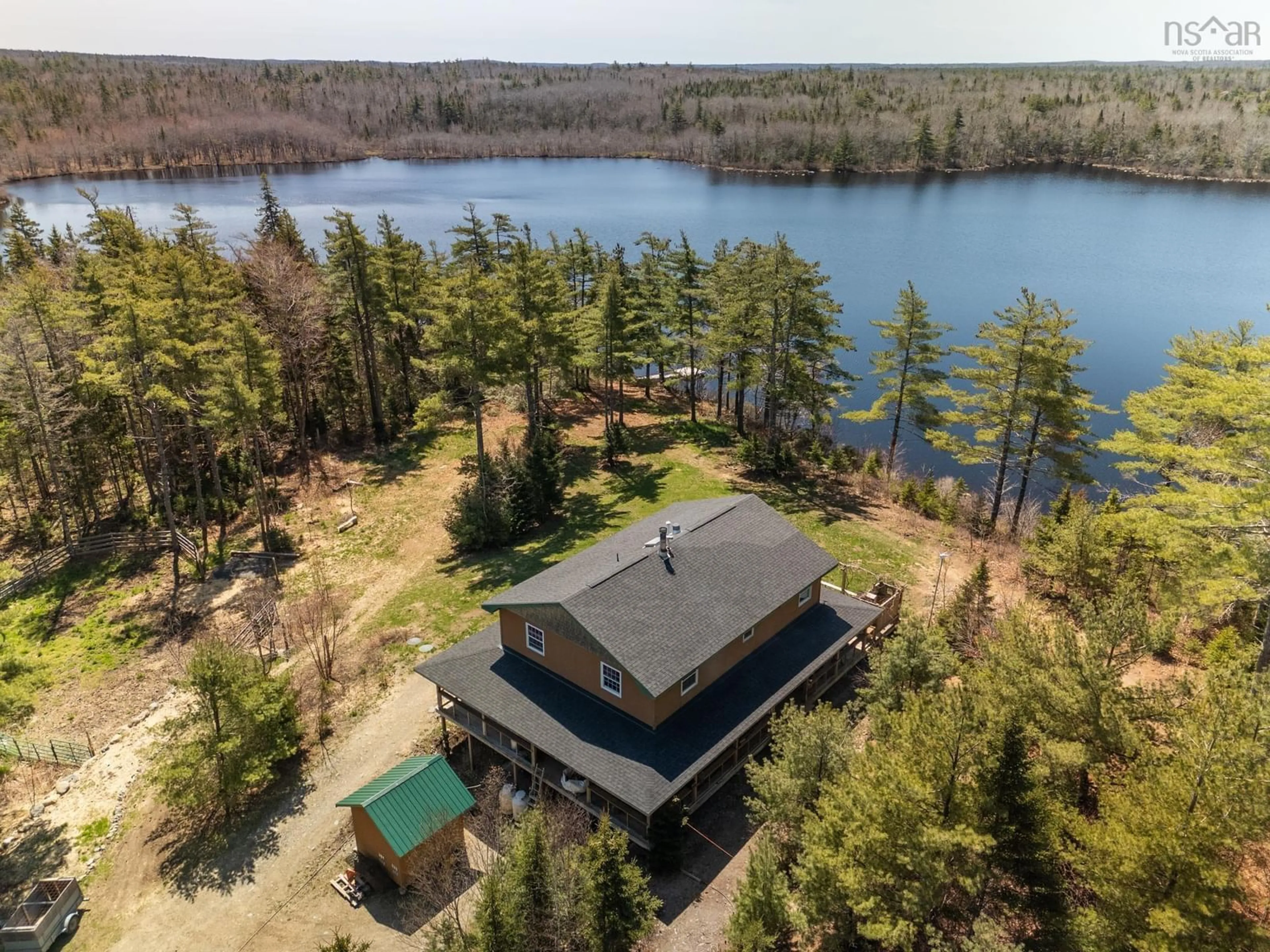 A pic from outside/outdoor area/front of a property/back of a property/a pic from drone, water/lake/river/ocean view for 236 Canoe Lake Estates Rd, East Quinan Nova Scotia B0W 3M0
