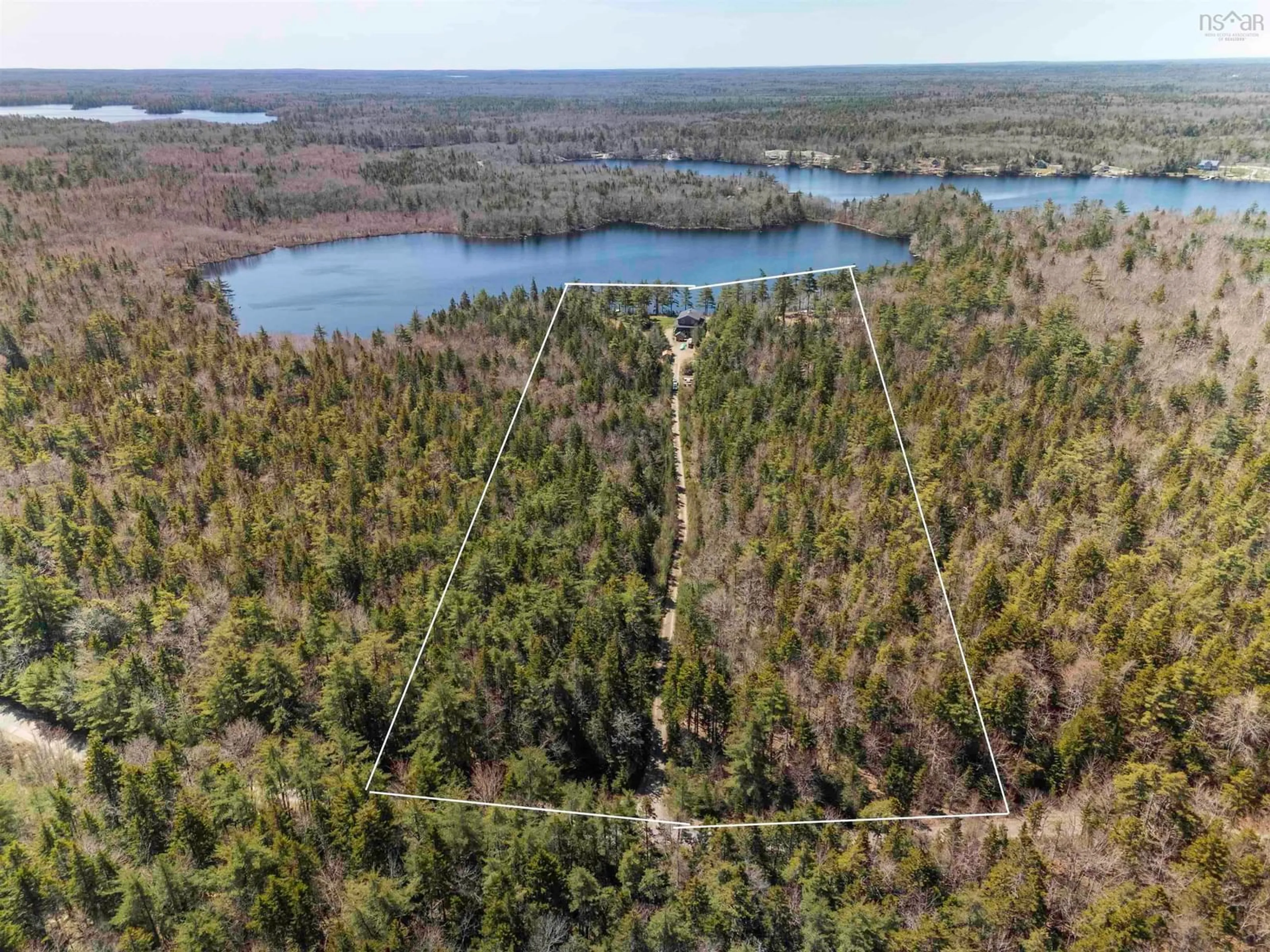 A pic from outside/outdoor area/front of a property/back of a property/a pic from drone, forest/trees view for 236 Canoe Lake Estates Rd, East Quinan Nova Scotia B0W 3M0