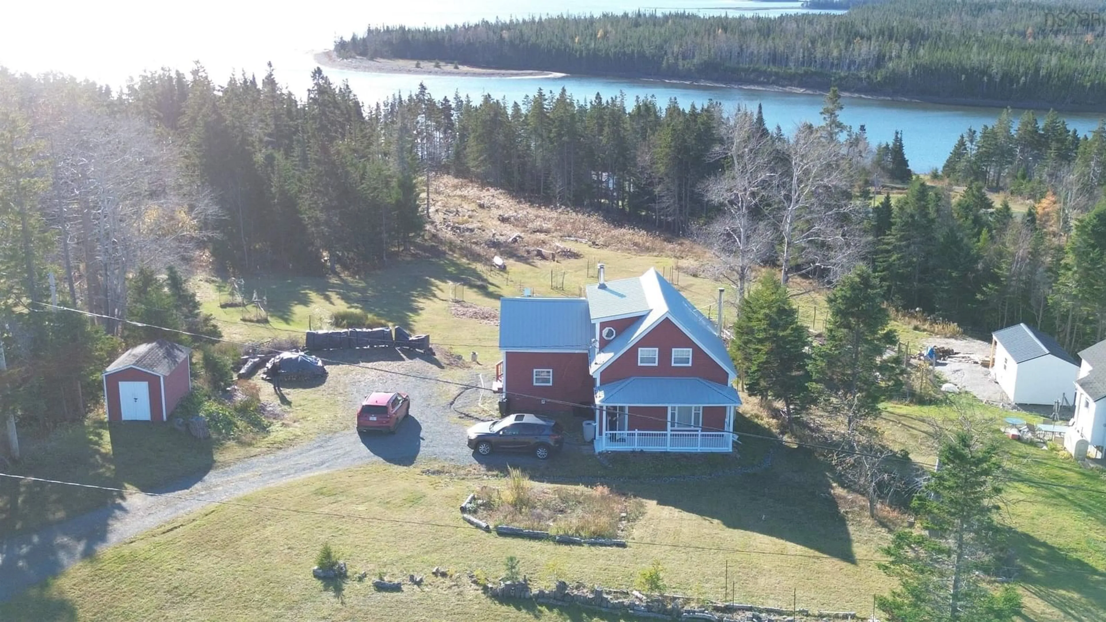 A pic from outside/outdoor area/front of a property/back of a property/a pic from drone, water/lake/river/ocean view for 9690 Grenville St, St. Peter's Nova Scotia B0E 3B0