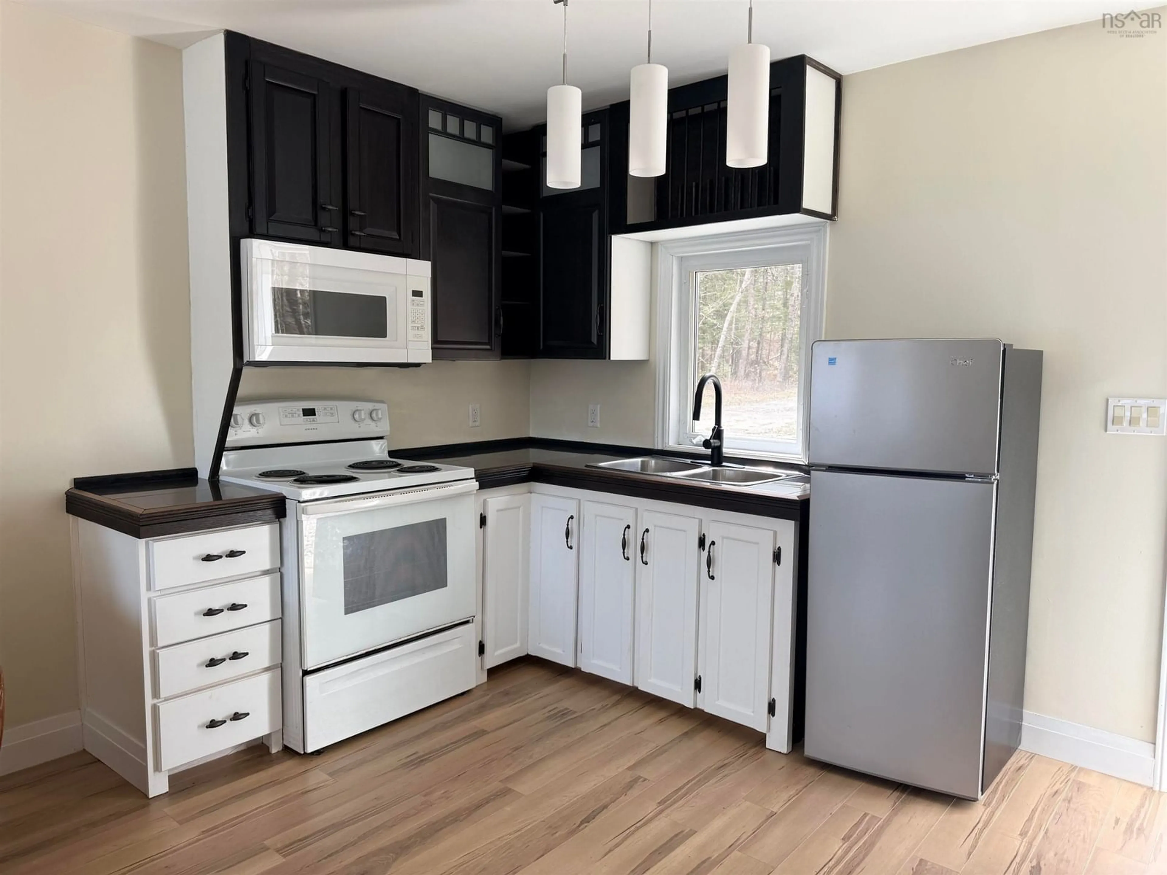 Standard kitchen, wood/laminate floor for 4874 Highway 340, Carleton Nova Scotia B5A 5P9