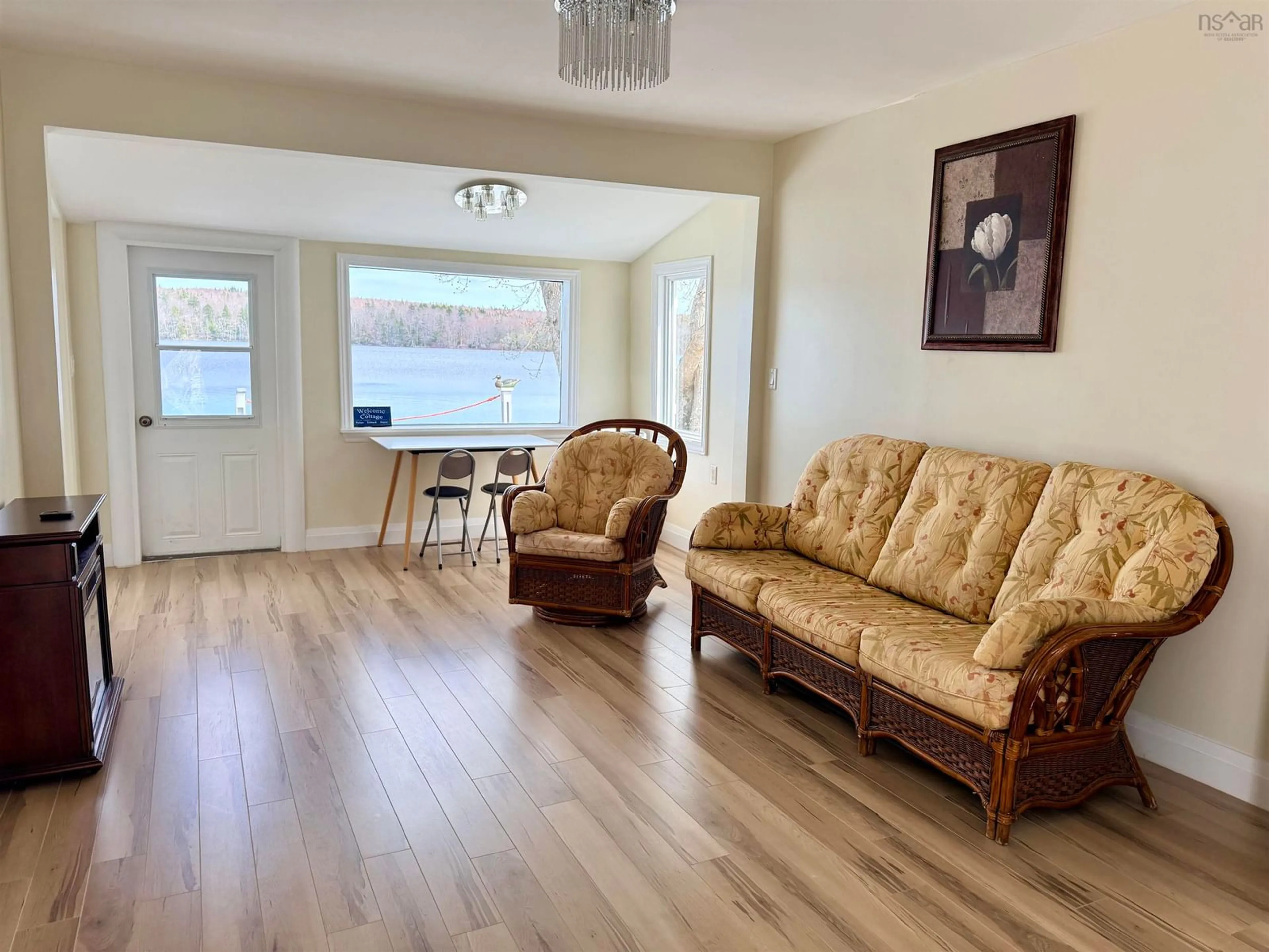 Living room with furniture, wood/laminate floor for 4874 Highway 340, Carleton Nova Scotia B5A 5P9