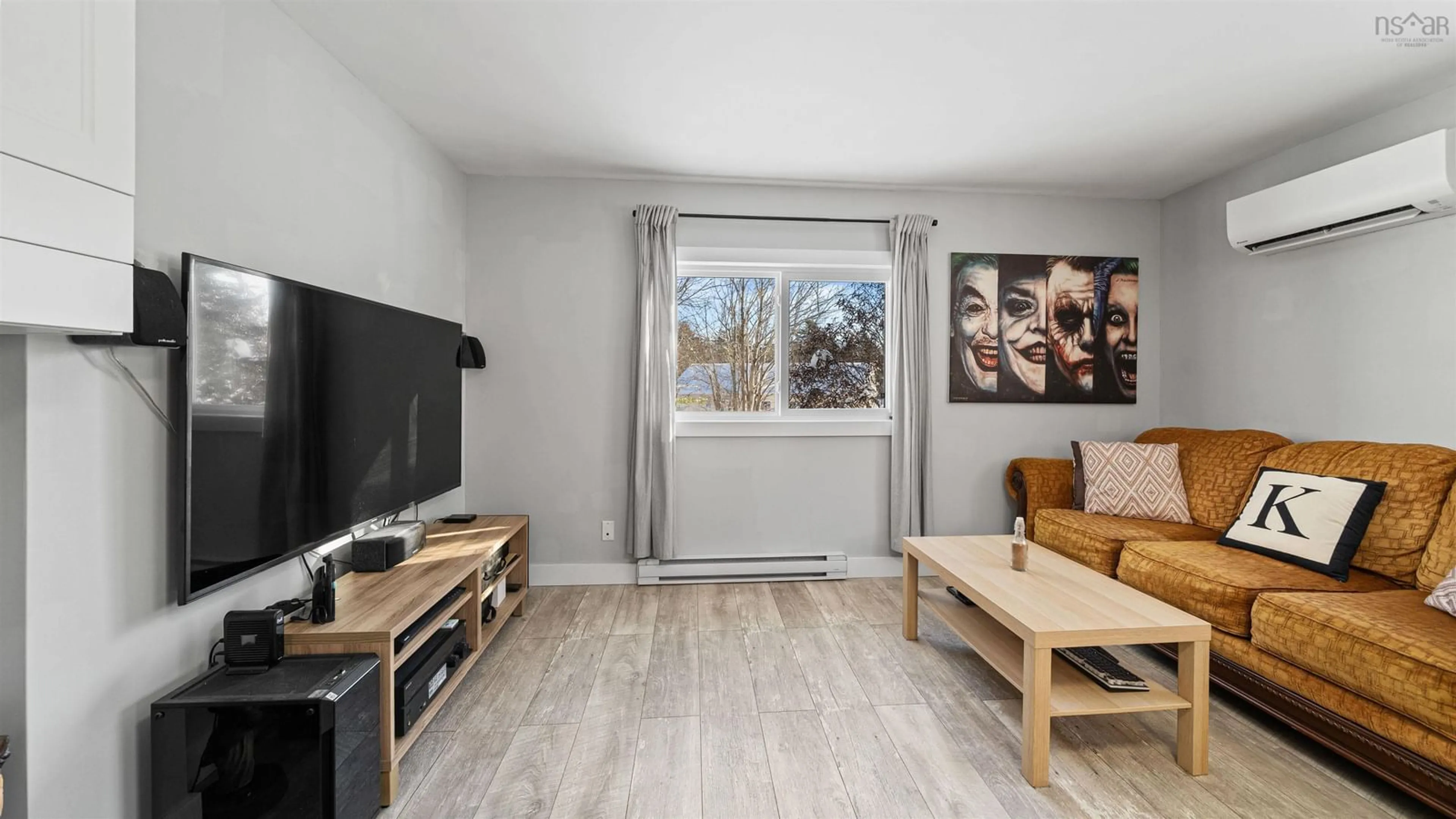 Living room with furniture, wood/laminate floor for 10 Sucker Brook St, Sackville Nova Scotia B4C 4E7