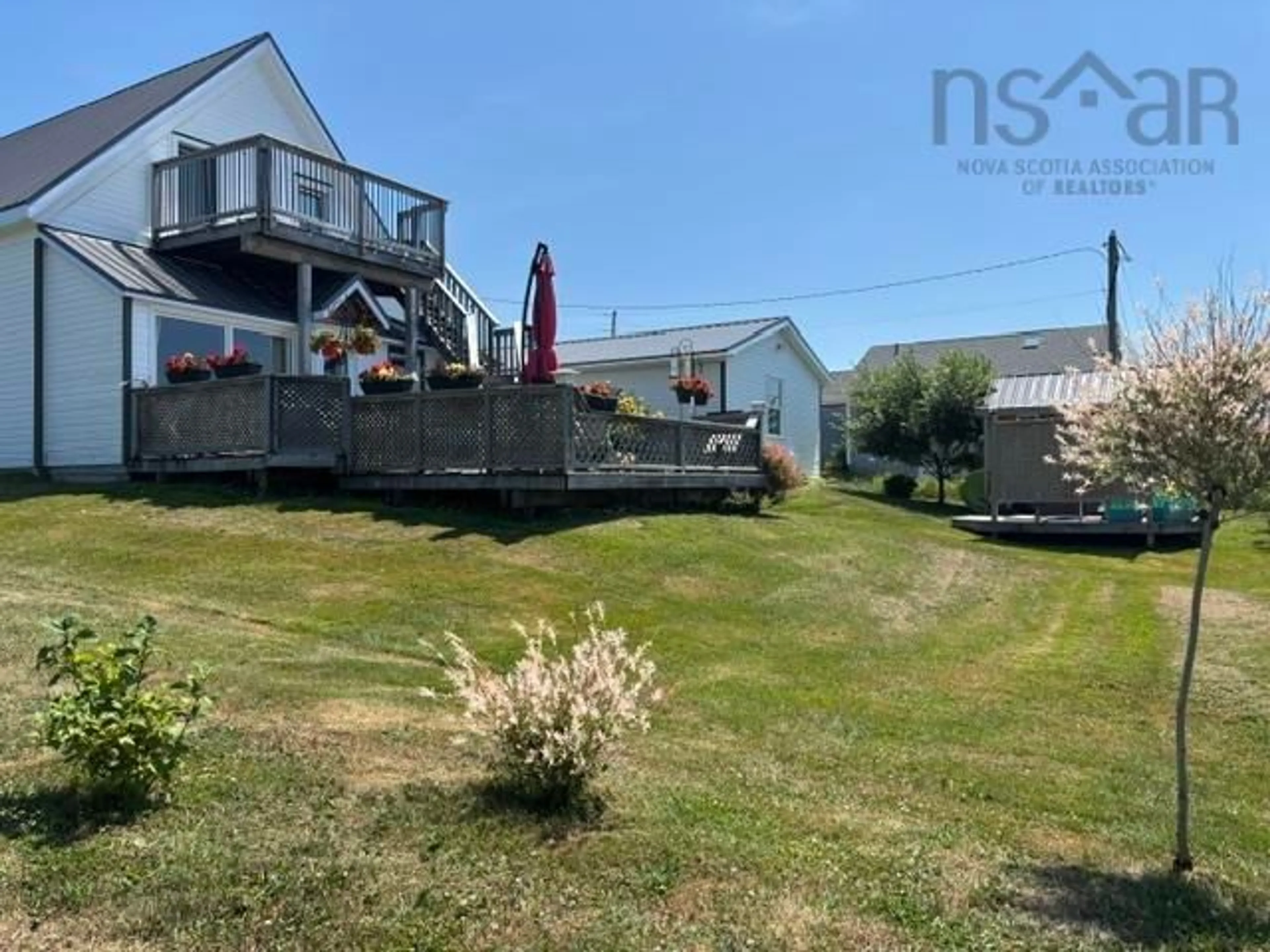 A pic from outside/outdoor area/front of a property/back of a property/a pic from drone, water/lake/river/ocean view for 8667 Hwy 19, Port Hood Nova Scotia B0E 2W0