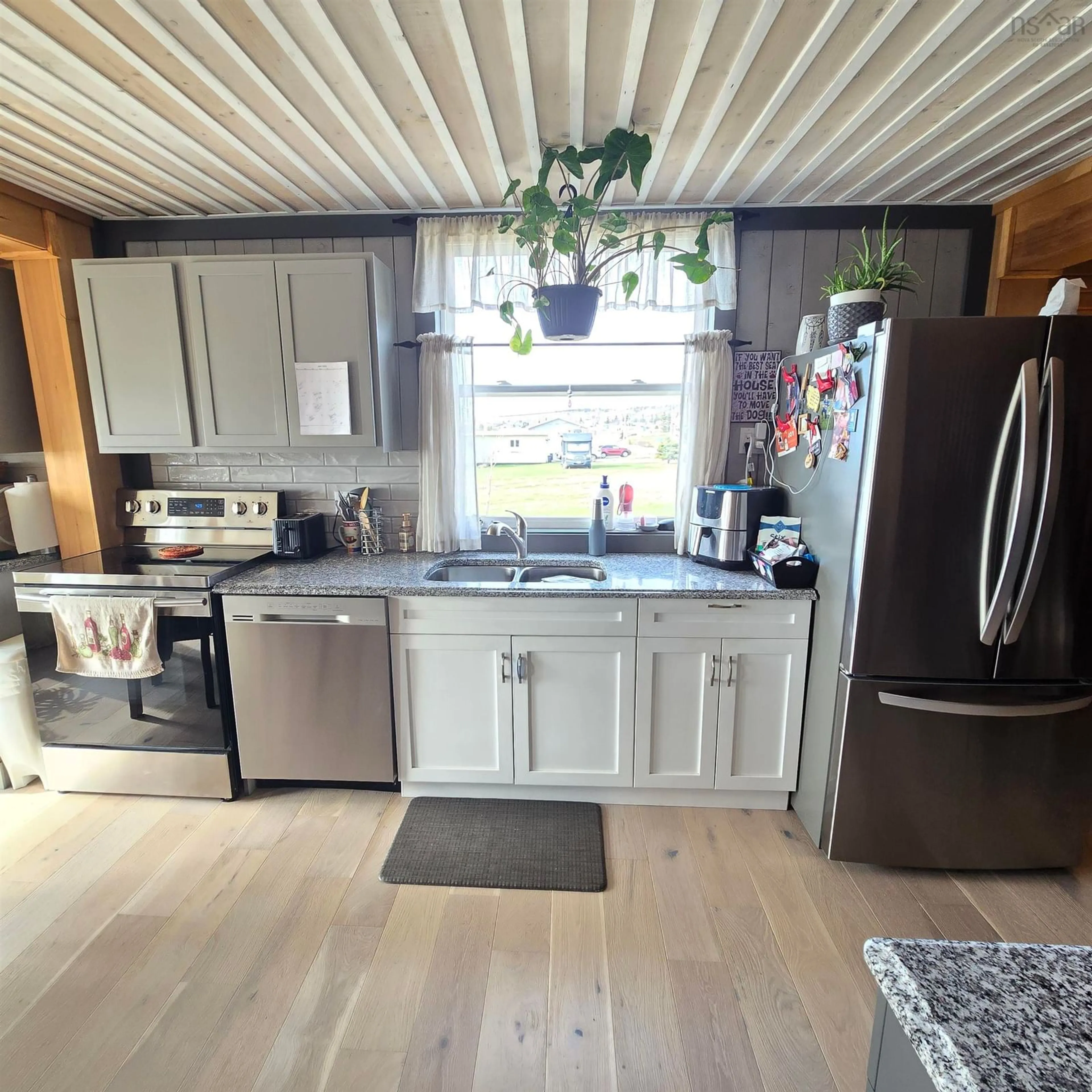 Open concept kitchen, wood/laminate floor for 8667 Hwy 19, Port Hood Nova Scotia B0E 2W0