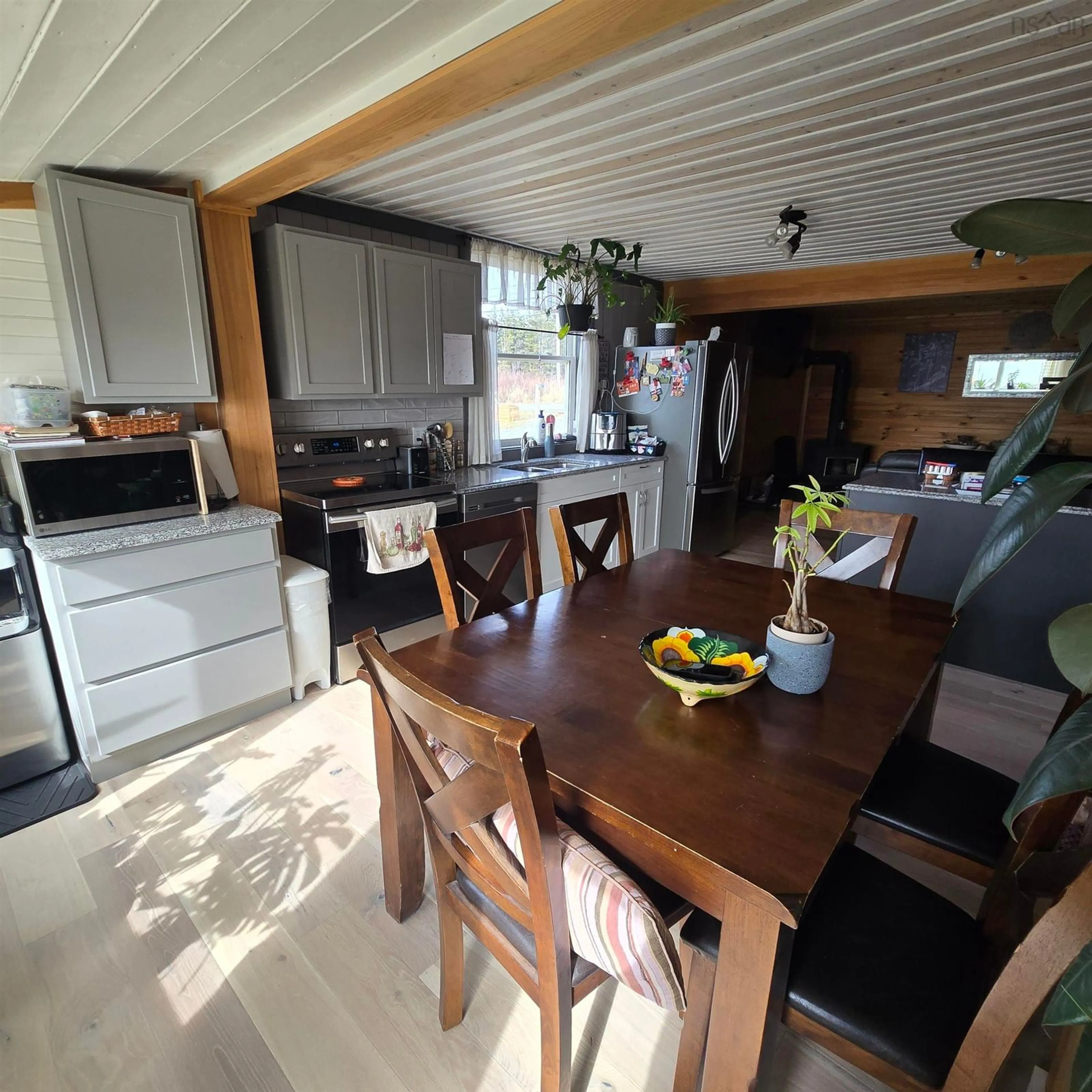 Open concept kitchen, wood/laminate floor for 8667 Hwy 19, Port Hood Nova Scotia B0E 2W0