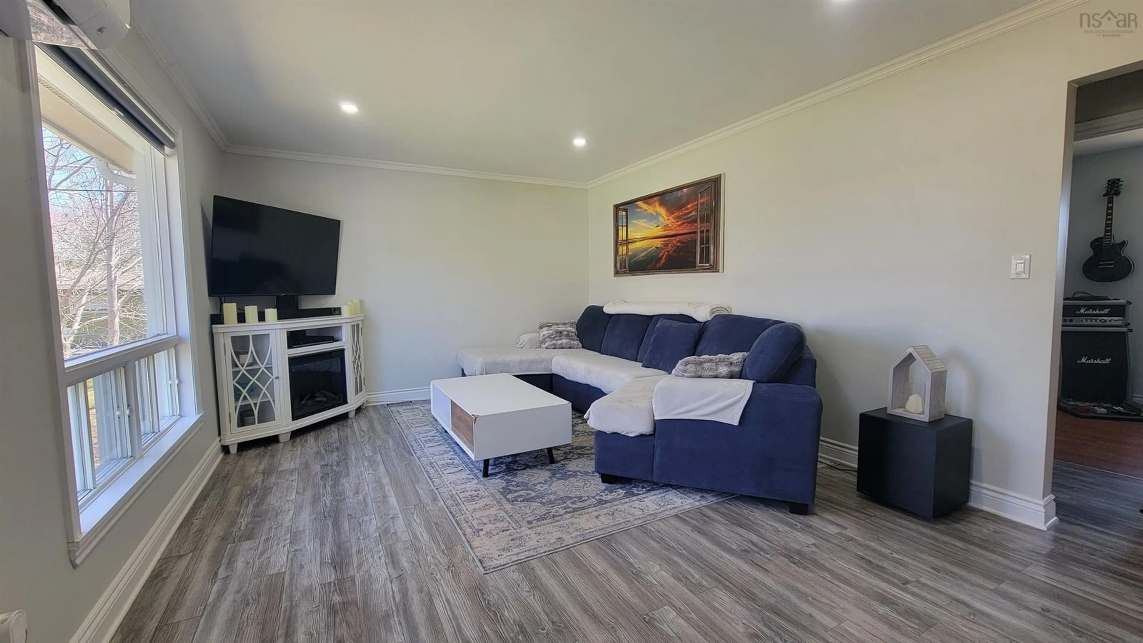 Living room with furniture, wood/laminate floor for 202 Saunders Rd, Deerfield Nova Scotia B5A 5N6