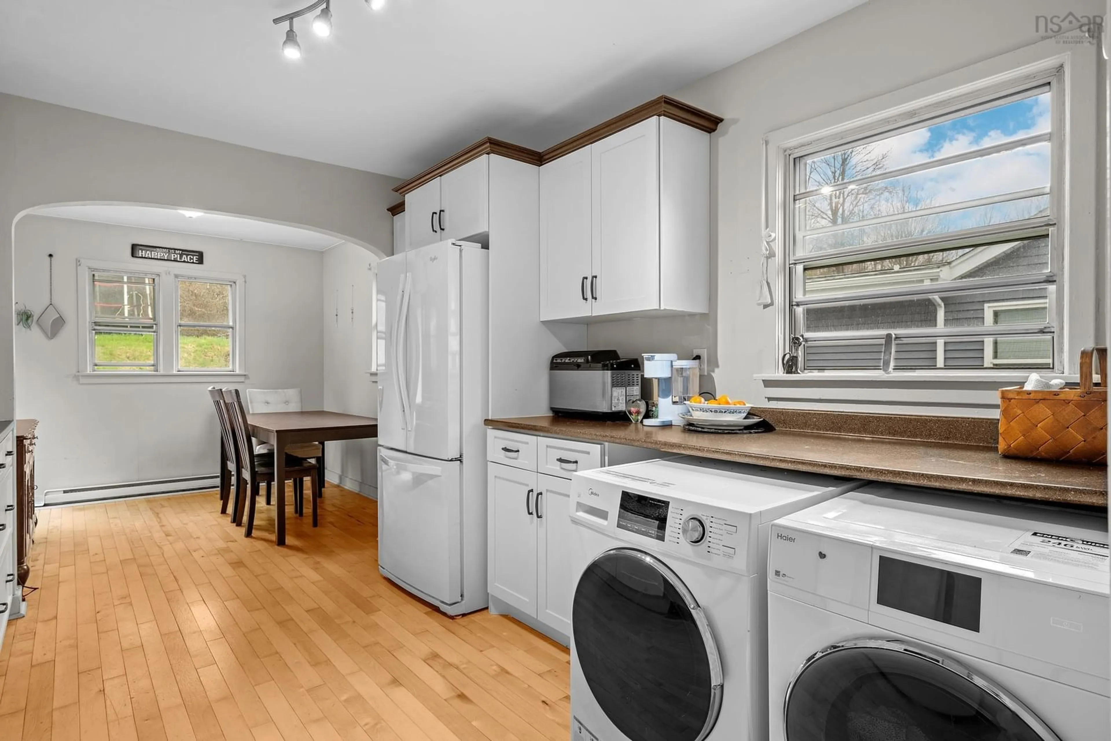 Kitchen with laundary machines, wood/laminate floor for 3674 Lynch St, Halifax Nova Scotia B3K 3L2