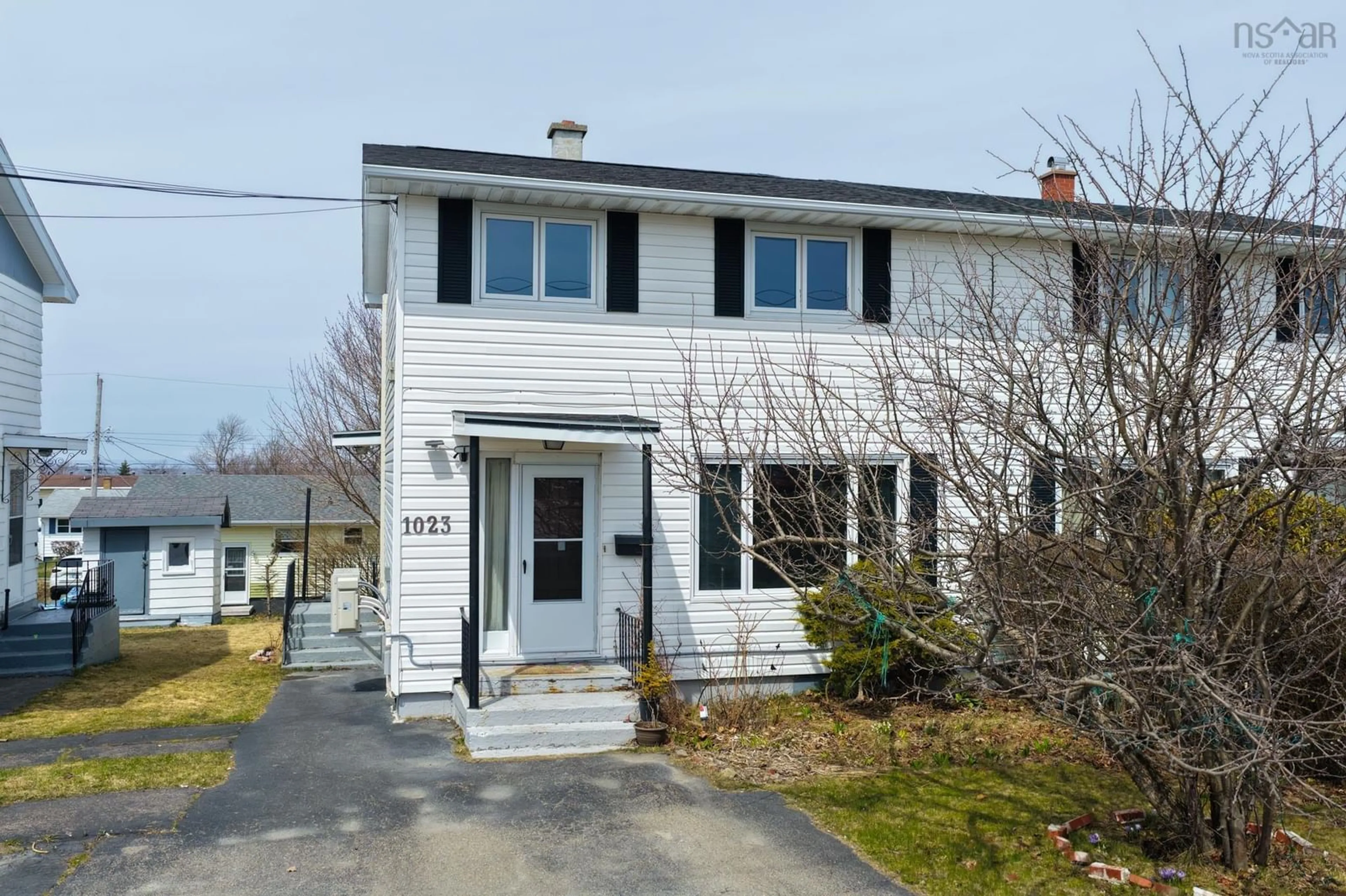 Home with vinyl exterior material, street for 1023 Upper Prince St, Sydney Nova Scotia B1P 5P3