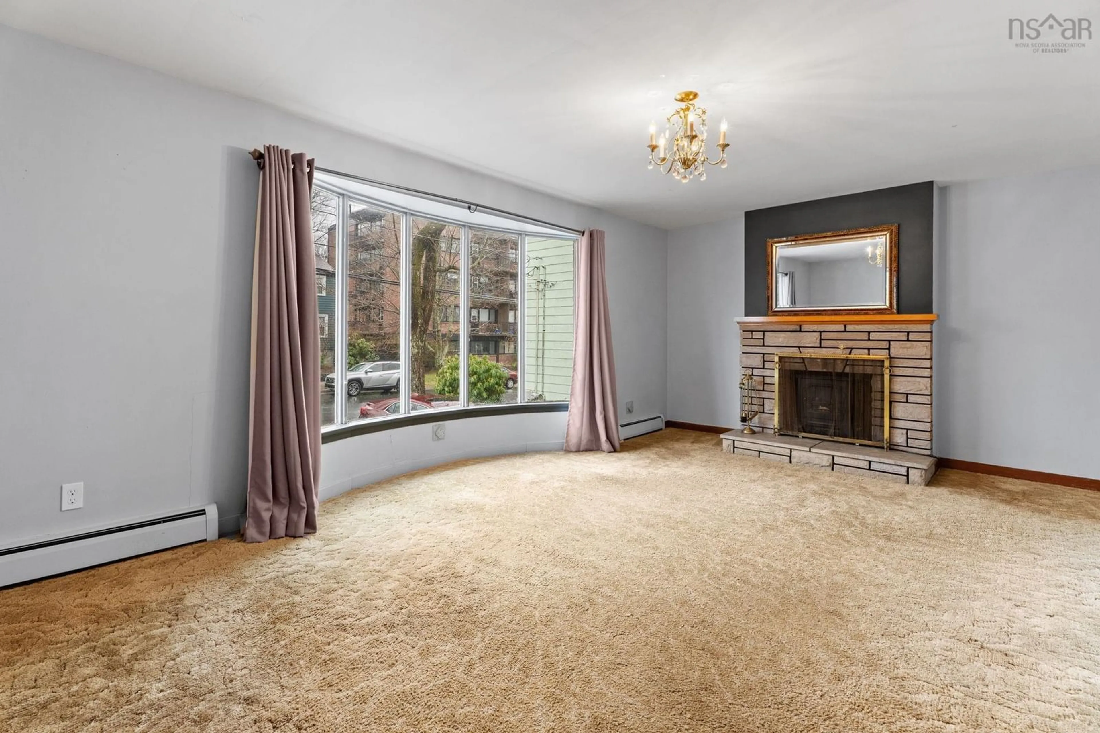 Living room with furniture, carpet floor for 6291 Cork St, West End Nova Scotia B3L 1Y8