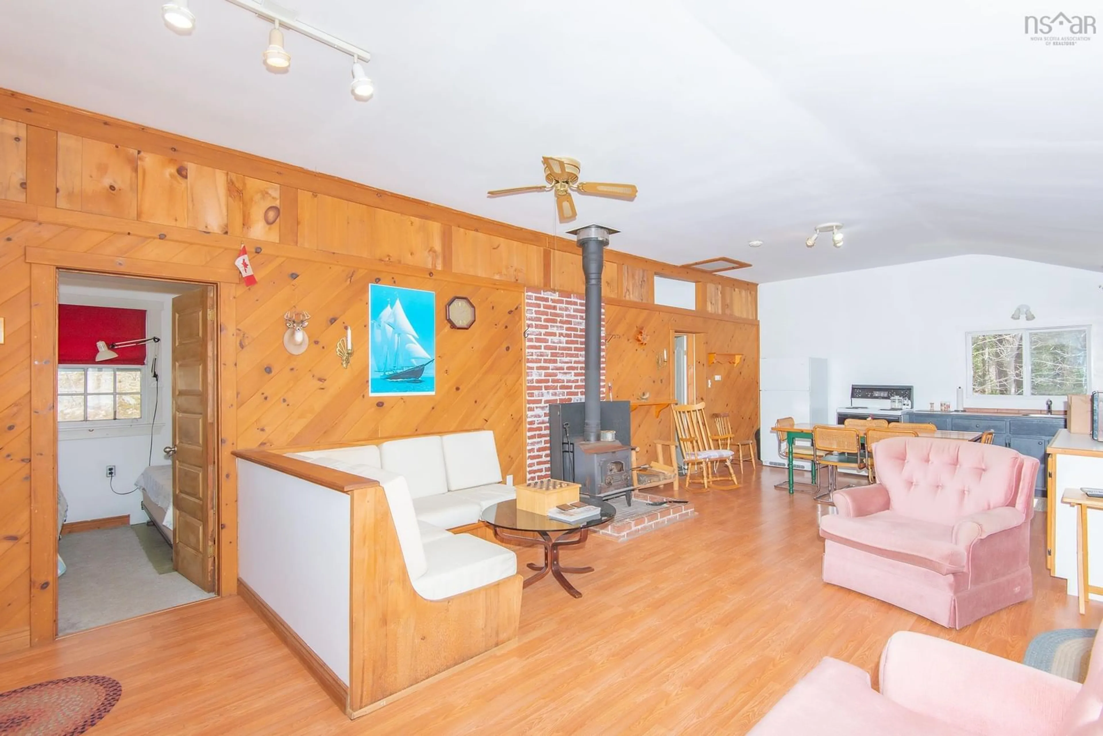 Living room with furniture, wood/laminate floor for 164 North Wrights Lake Rd, Doucetteville Nova Scotia B0W 1H0