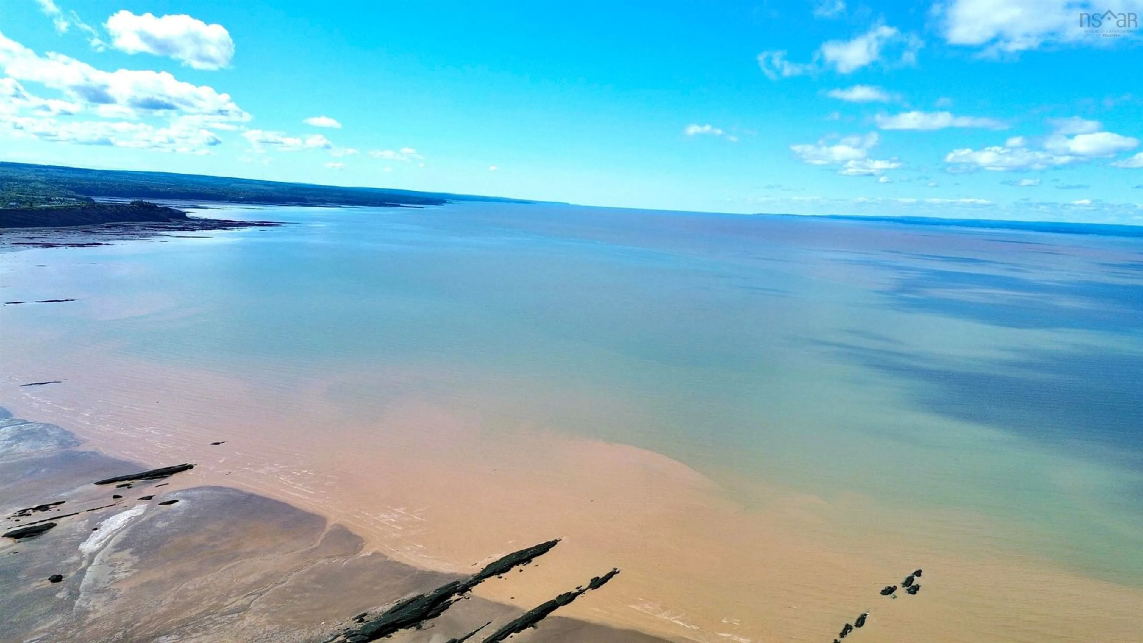 A pic from outside/outdoor area/front of a property/back of a property/a pic from drone, water/lake/river/ocean view for 139 Main St, Joggins Nova Scotia B0L 1A0