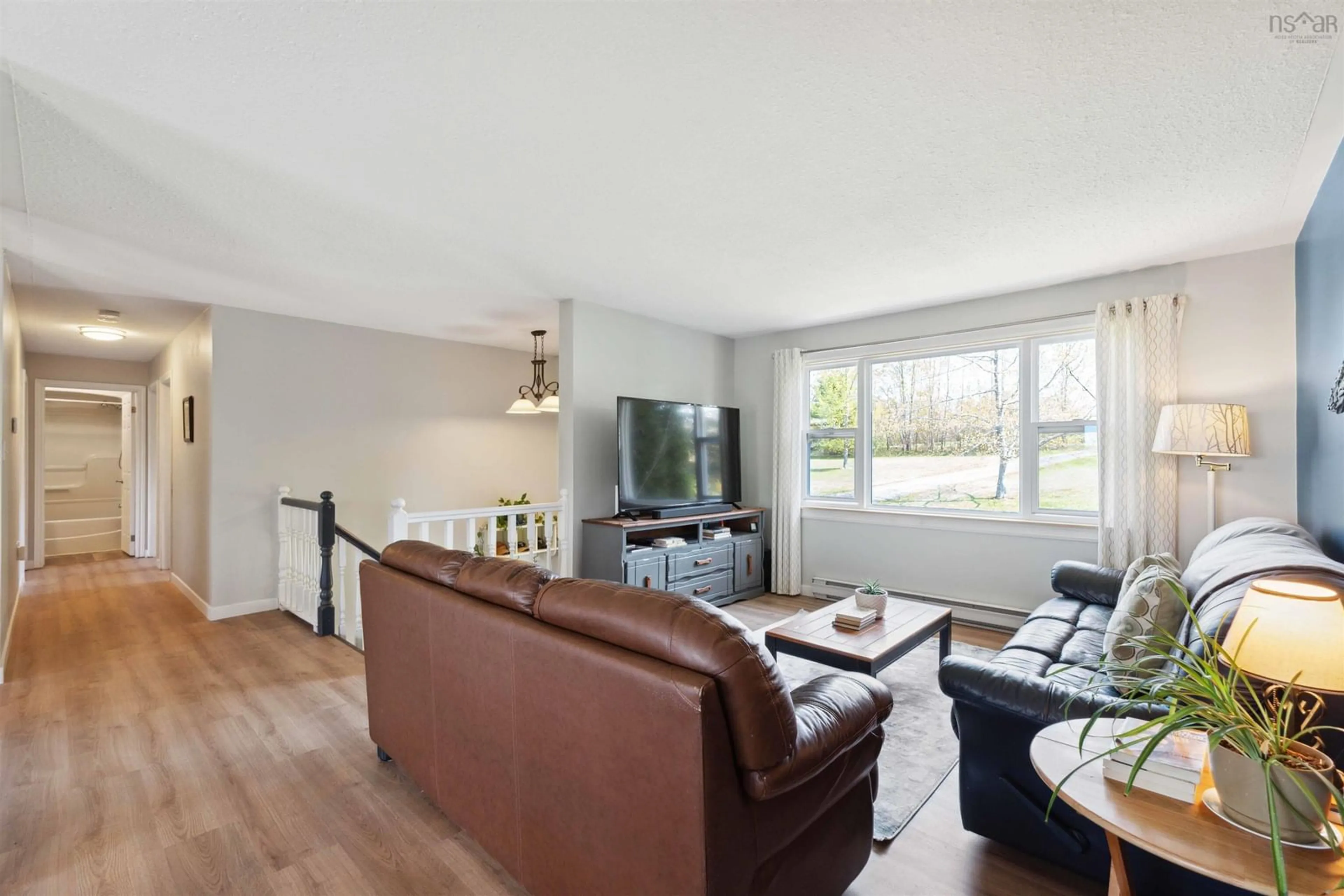 Living room with furniture, wood/laminate floor for 2345 Harmony Road, Aylesford Nova Scotia B0P 1C0