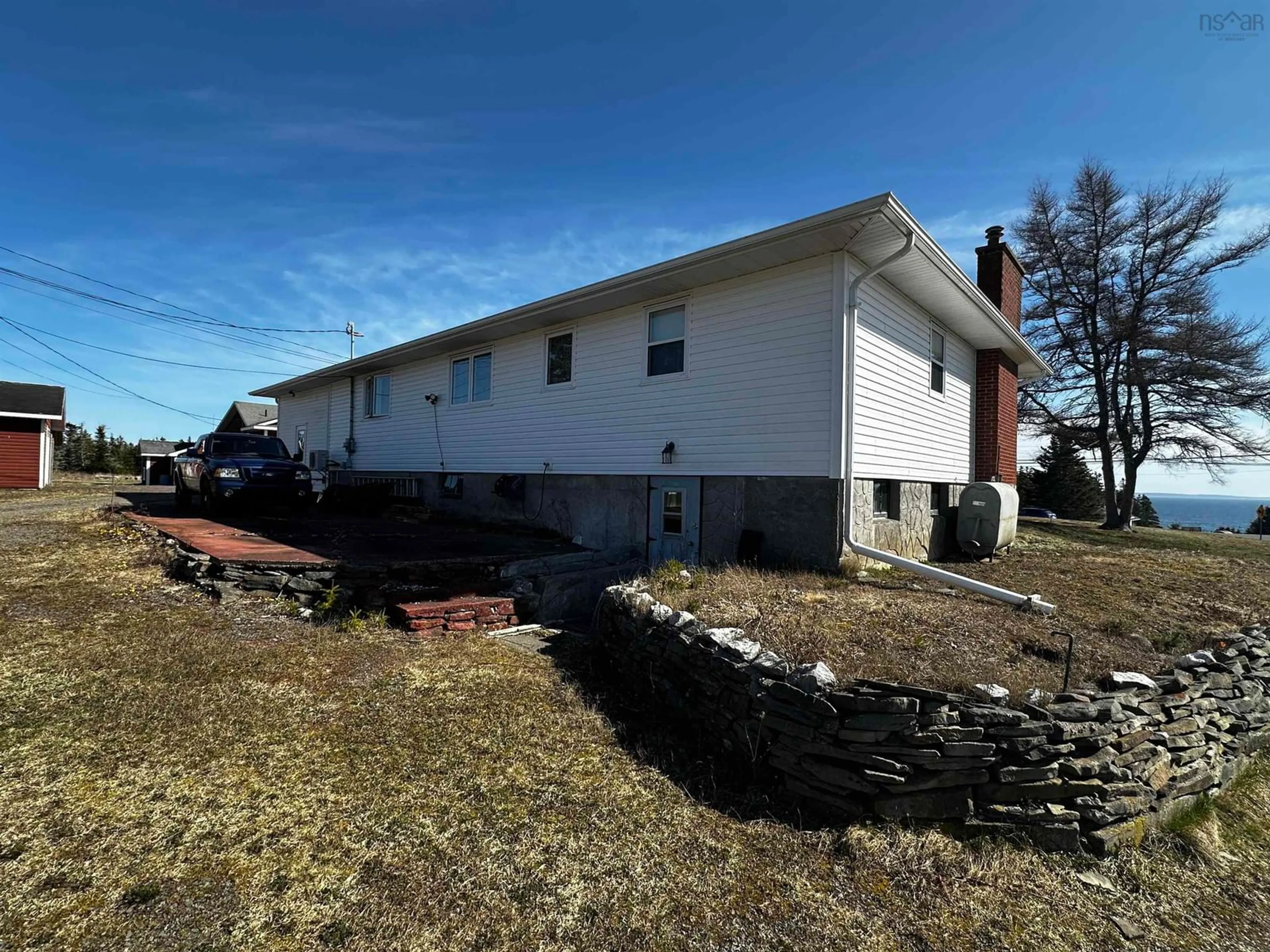 A pic from outside/outdoor area/front of a property/back of a property/a pic from drone, building for 1659 Ns-206 Hwy, West Arichat Nova Scotia B0E 3J0