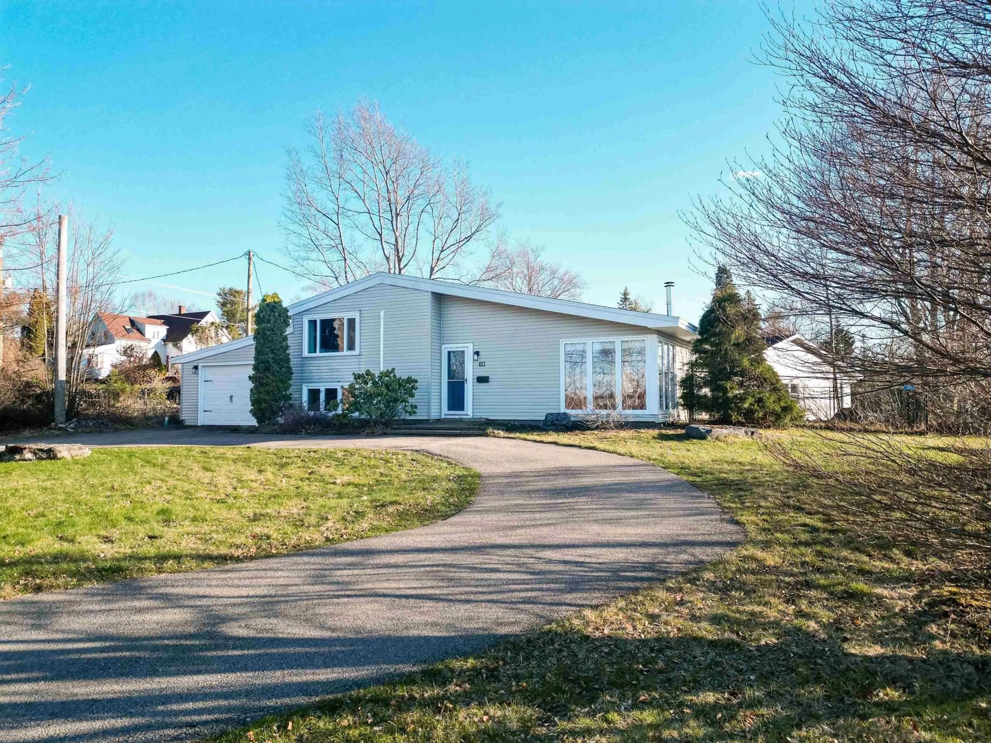 Home with vinyl exterior material, street for 60 Riverside Dr, Sydney River Nova Scotia B1S 1G4