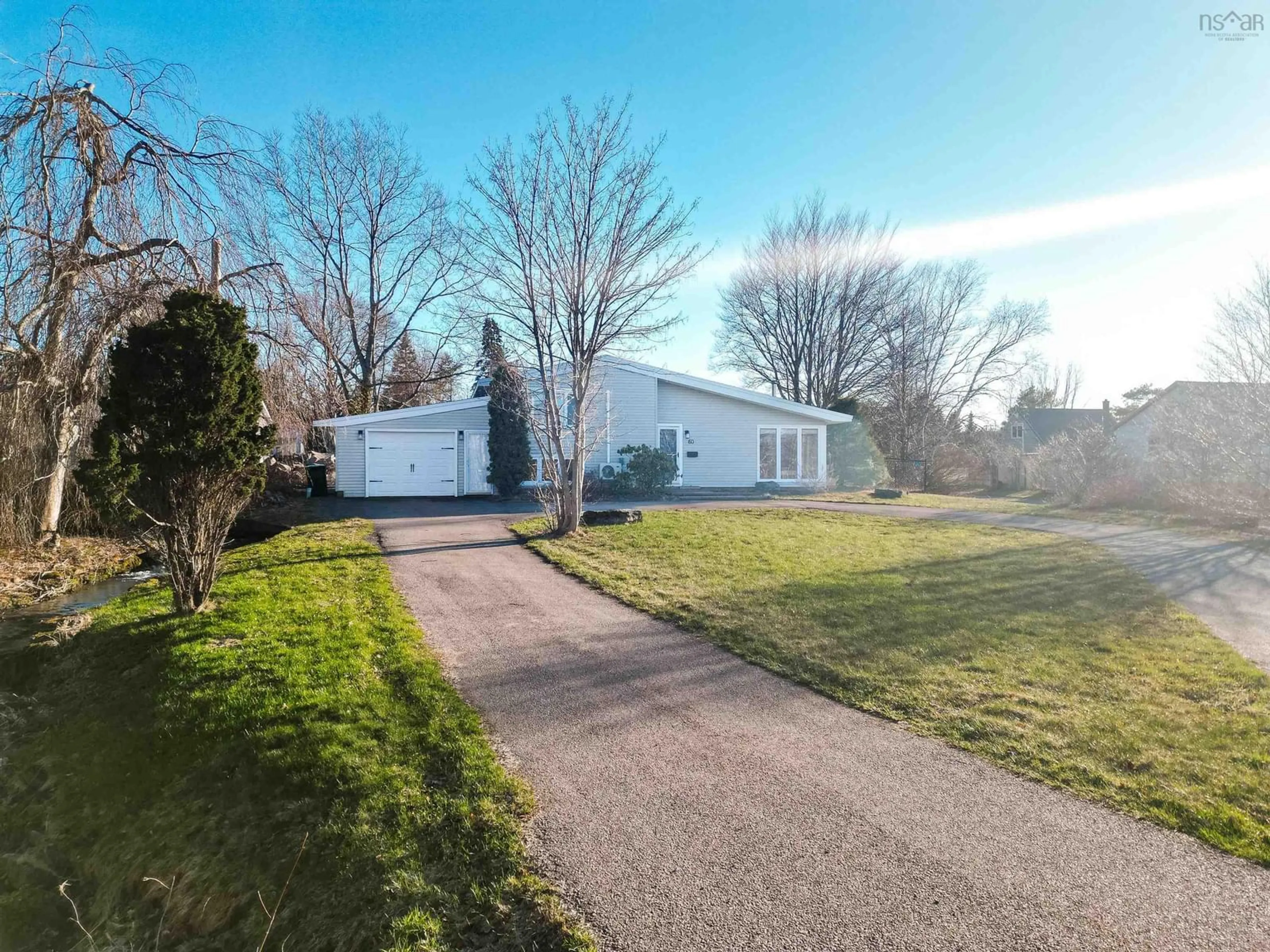 A pic from outside/outdoor area/front of a property/back of a property/a pic from drone, street for 60 Riverside Dr, Sydney River Nova Scotia B1S 1G4