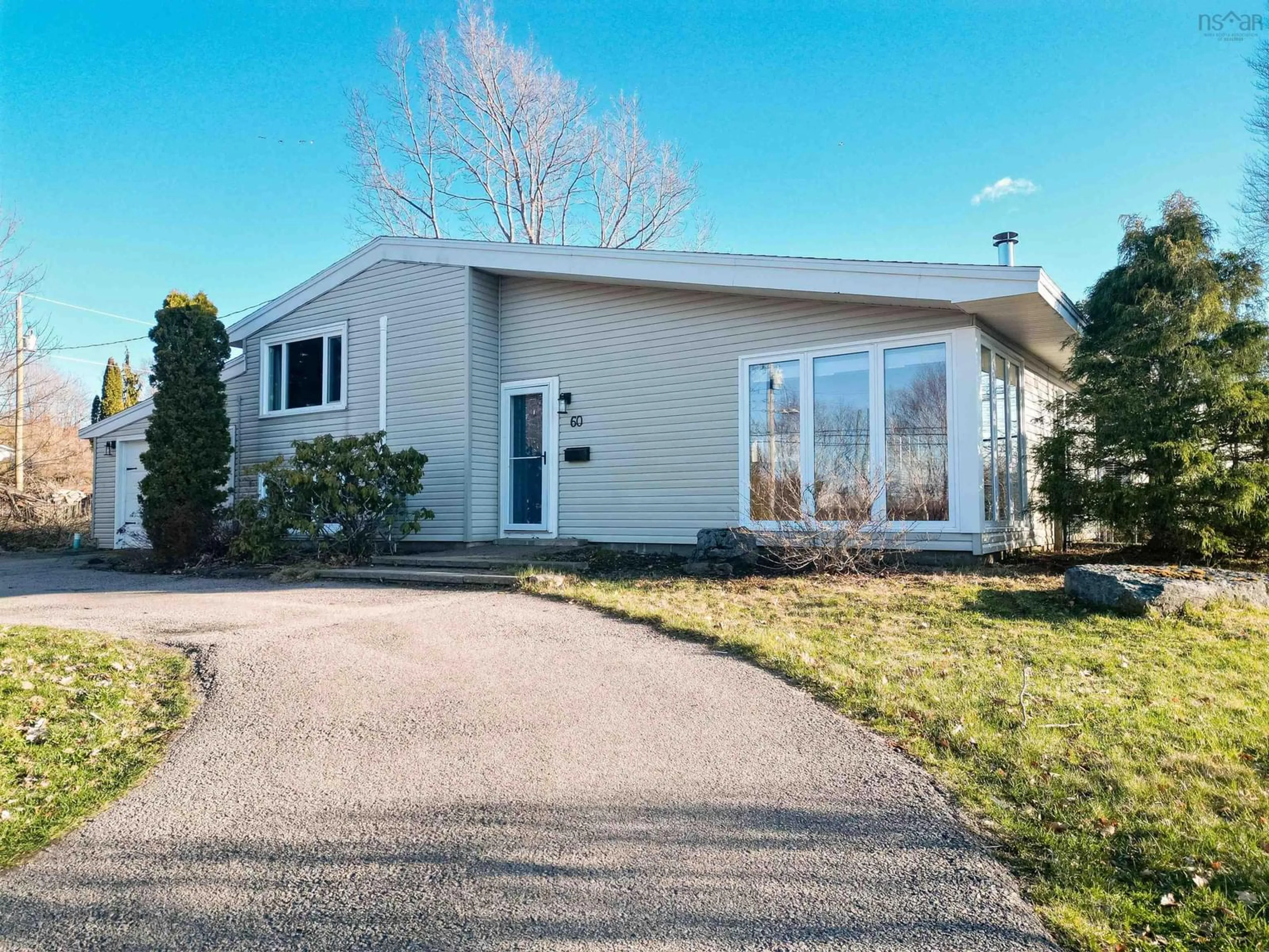 Home with vinyl exterior material, street for 60 Riverside Dr, Sydney River Nova Scotia B1S 1G4