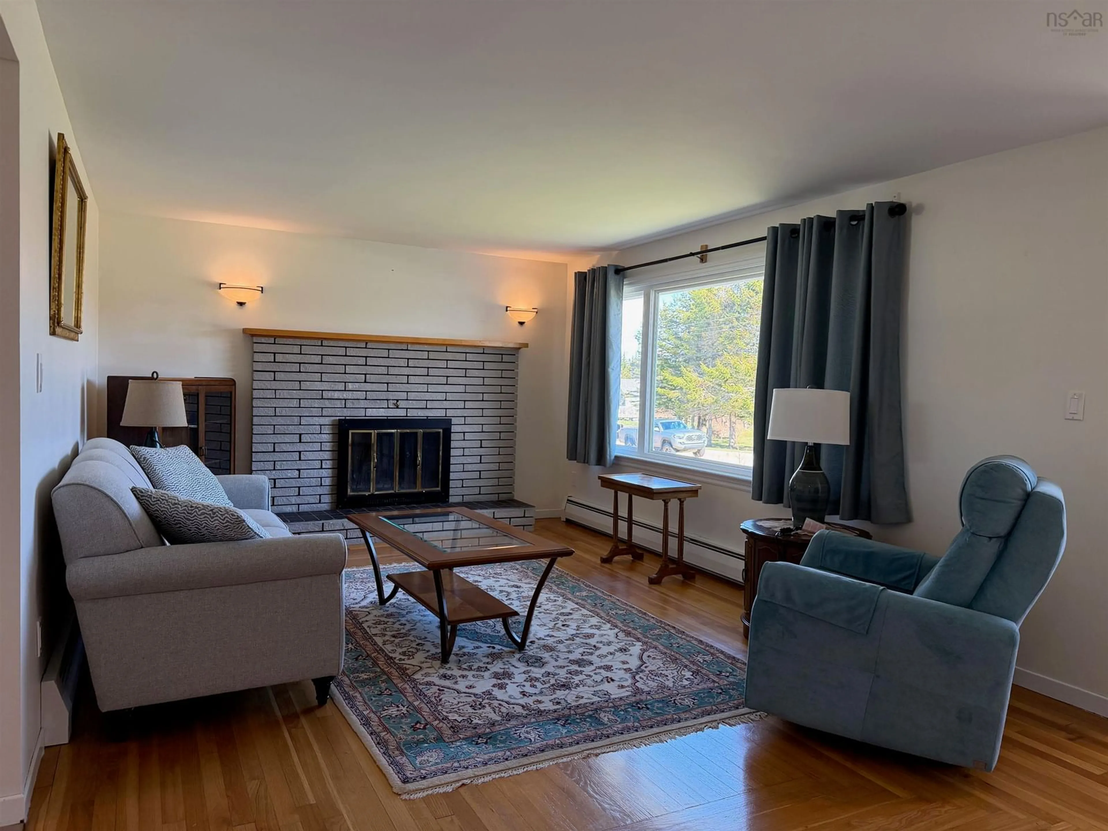 Living room with furniture, wood/laminate floor for 51 Surette Rd, Wedgeport Nova Scotia B0W 3P0