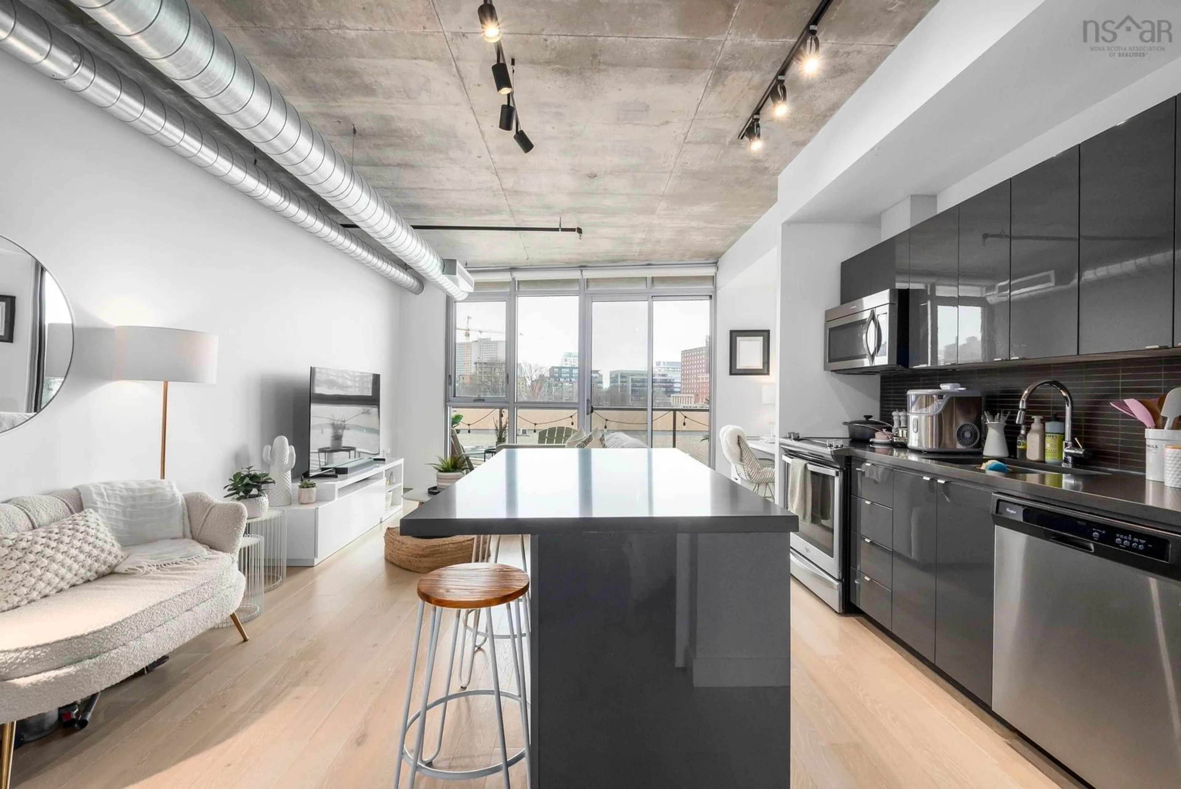 Open concept kitchen, cement floor for 1065 Barrington St #504, Halifax Nova Scotia B3H 2P8