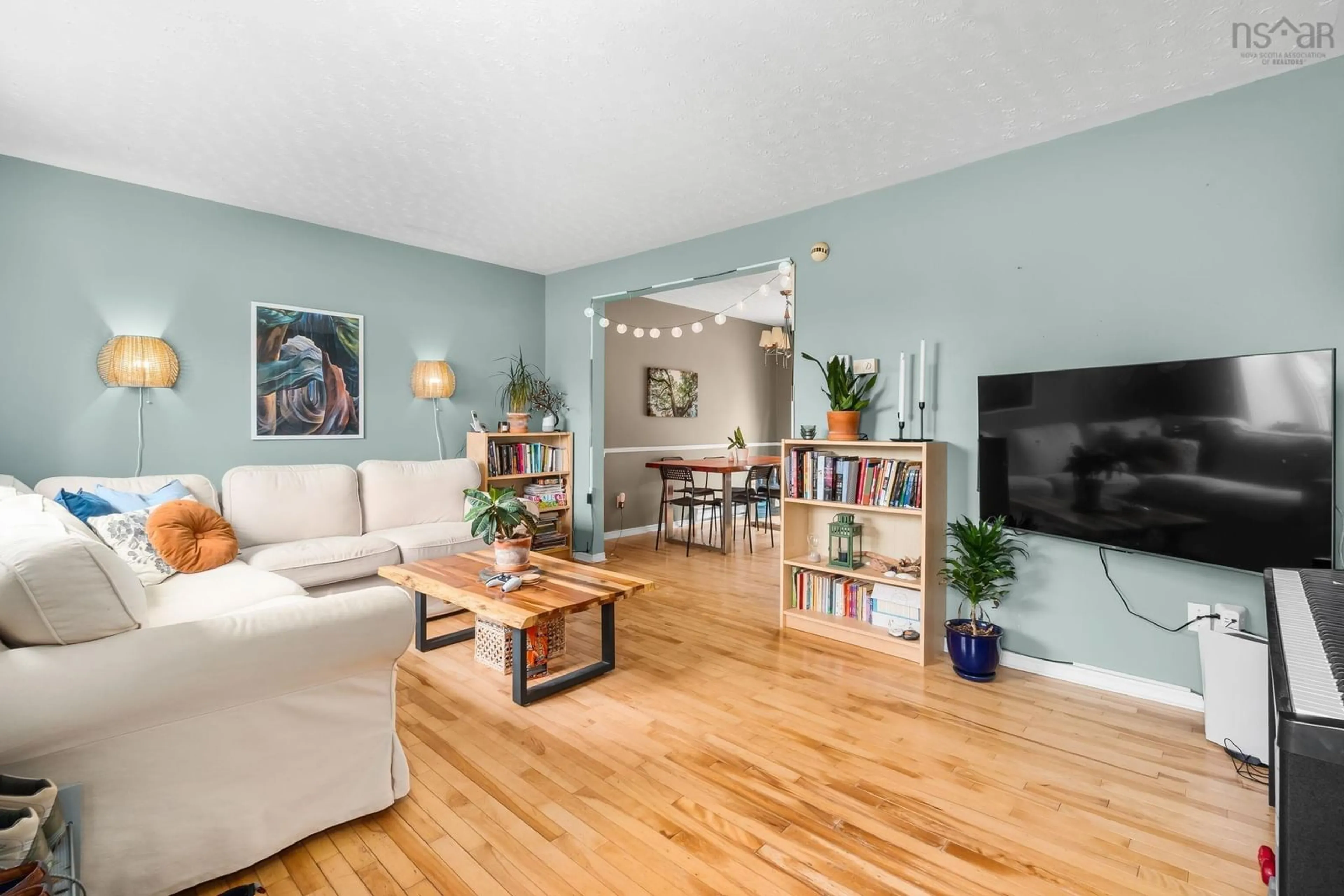 Living room with furniture, wood/laminate floor for 47 Governor's Lake Dr, Timberlea Nova Scotia B3T 1N2