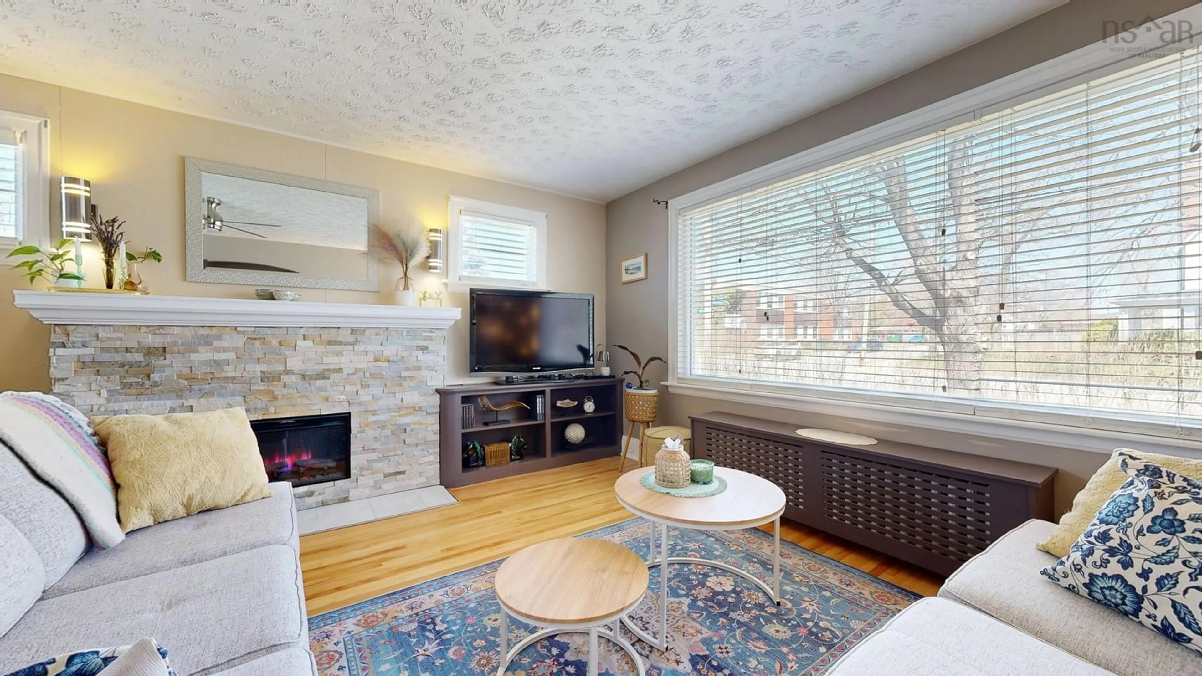 Living room with furniture, wood/laminate floor for 91 York St, Bridgewater Nova Scotia B4V 1R1