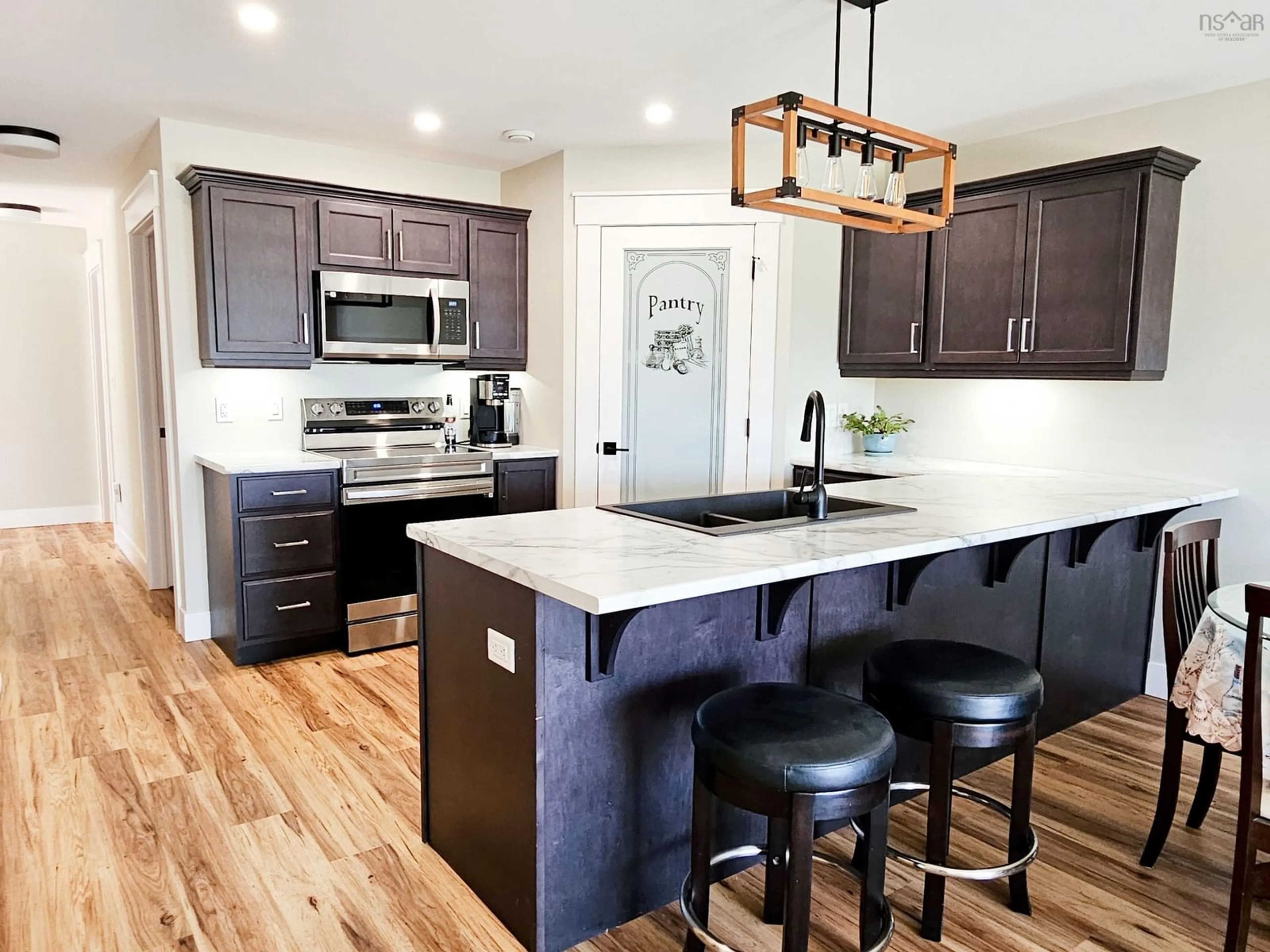 Open concept kitchen, wood/laminate floor for 79 Kent Rd, Lower Truro Nova Scotia B6L 1L2