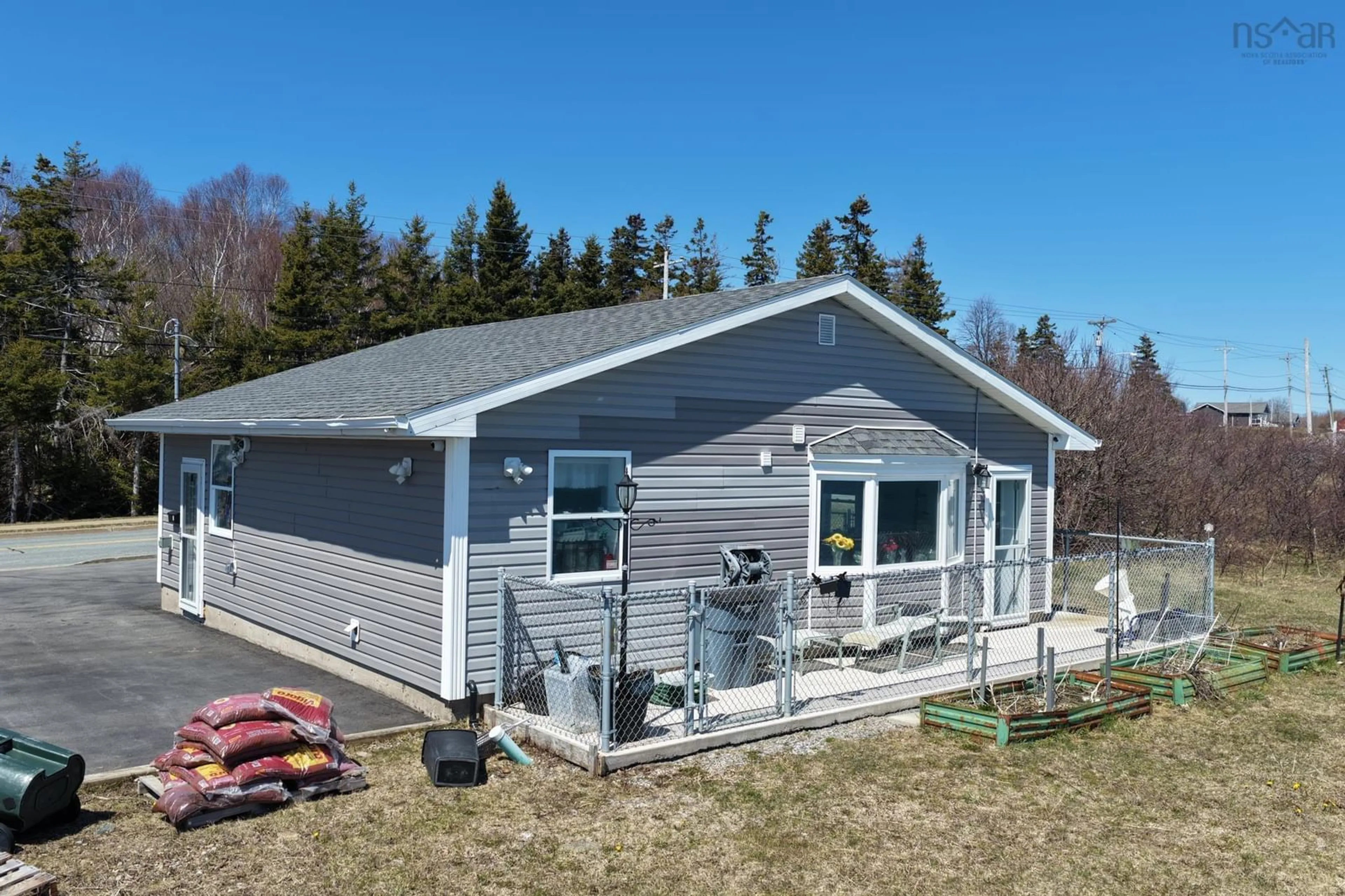A pic from outside/outdoor area/front of a property/back of a property/a pic from drone, unknown for 675 Shore Rd, Sydney Mines Nova Scotia B1V 1A2
