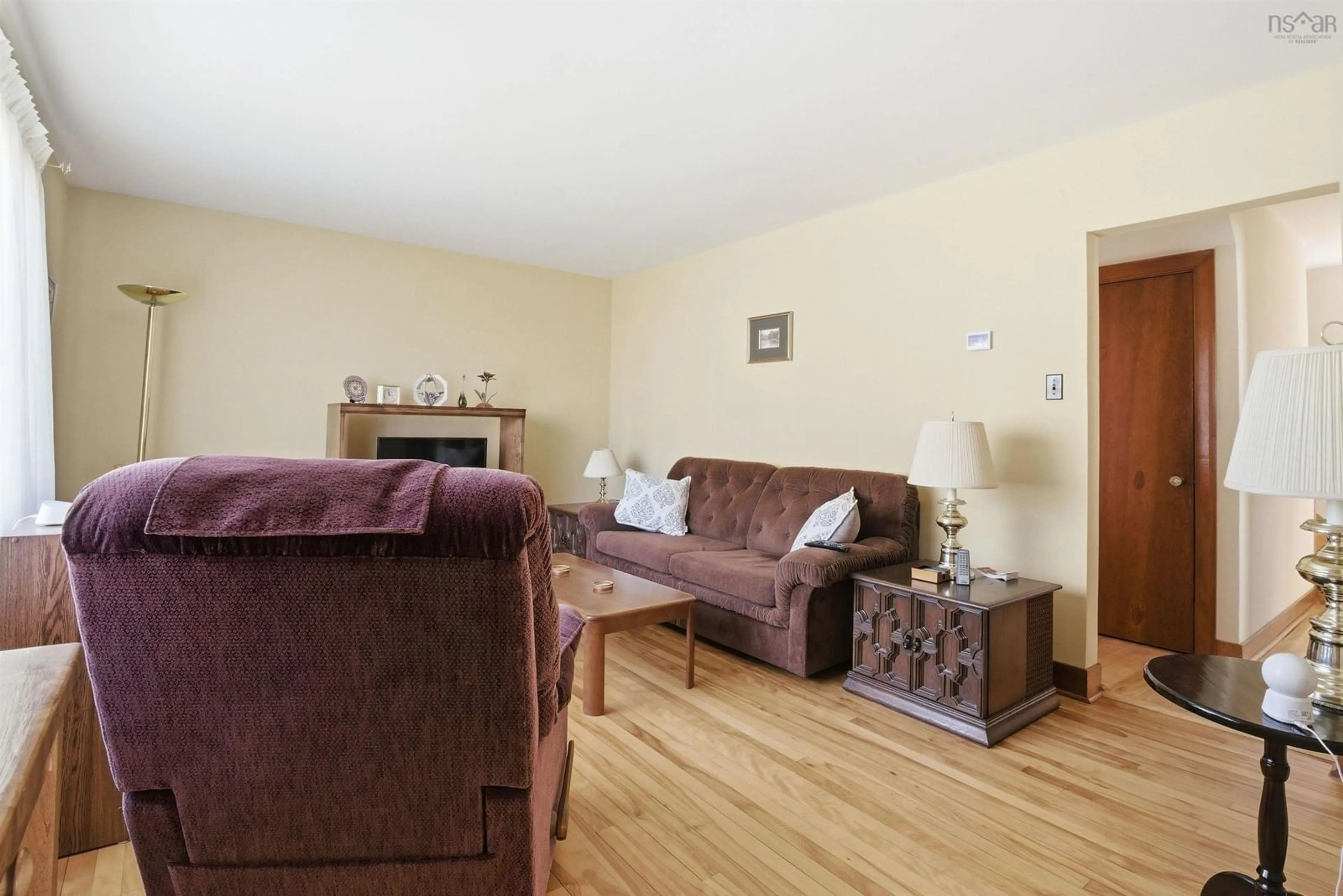 Living room with furniture, wood/laminate floor for 104 Melrose Ave, Halifax Nova Scotia B3N 2E4