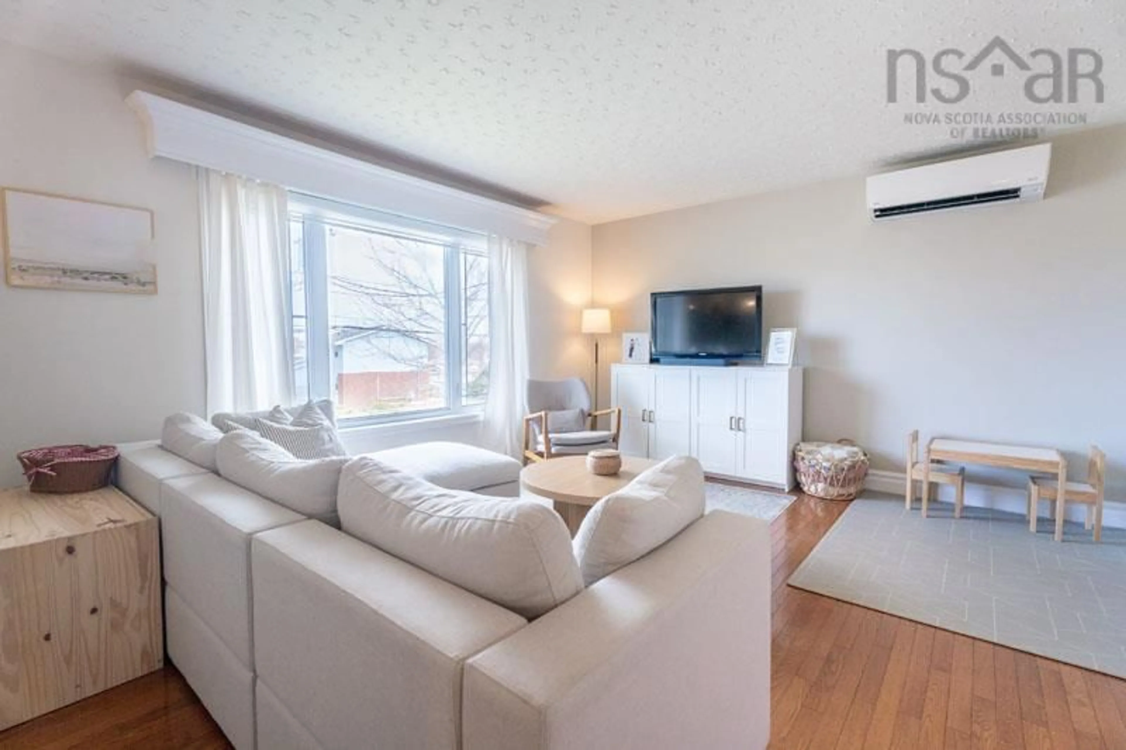 Living room with furniture, wood/laminate floor for 434 Colby Dr, Colby Village Nova Scotia B2V 2K6