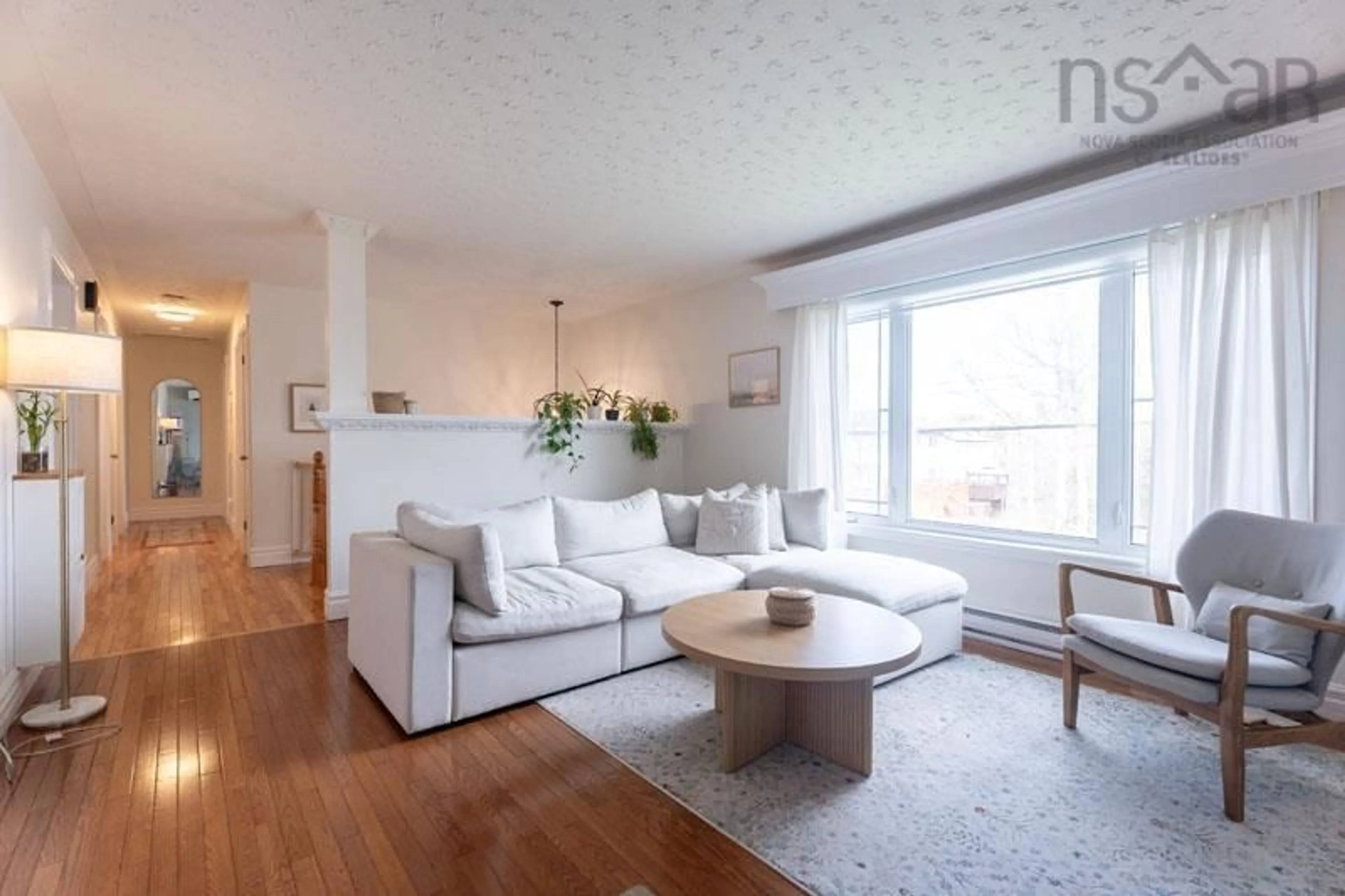 Living room with furniture, wood/laminate floor for 434 Colby Dr, Colby Village Nova Scotia B2V 2K6