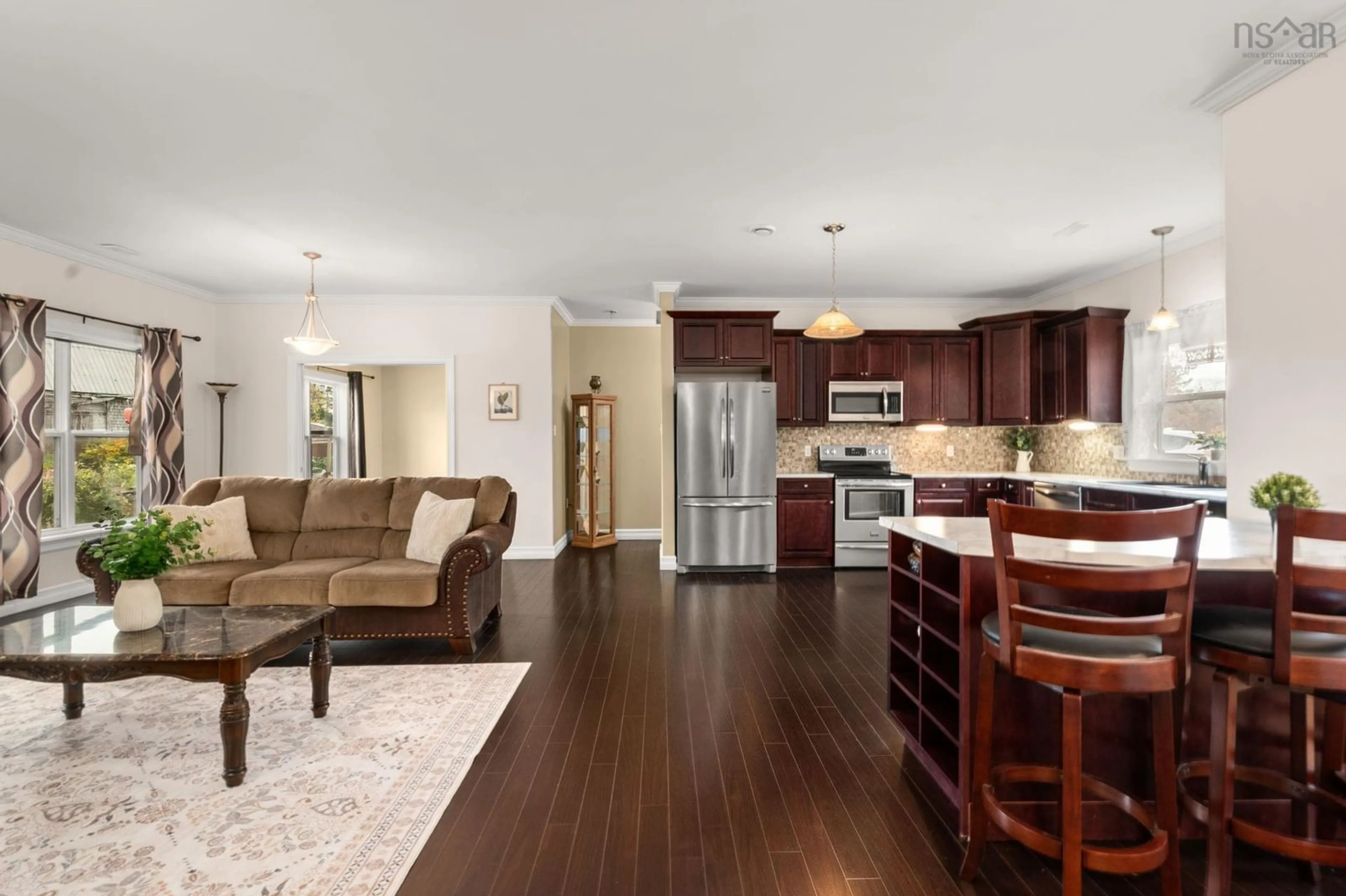 Open concept kitchen, wood/laminate floor for 6874 Highway 354, Kennetcook Nova Scotia B0N 1P0