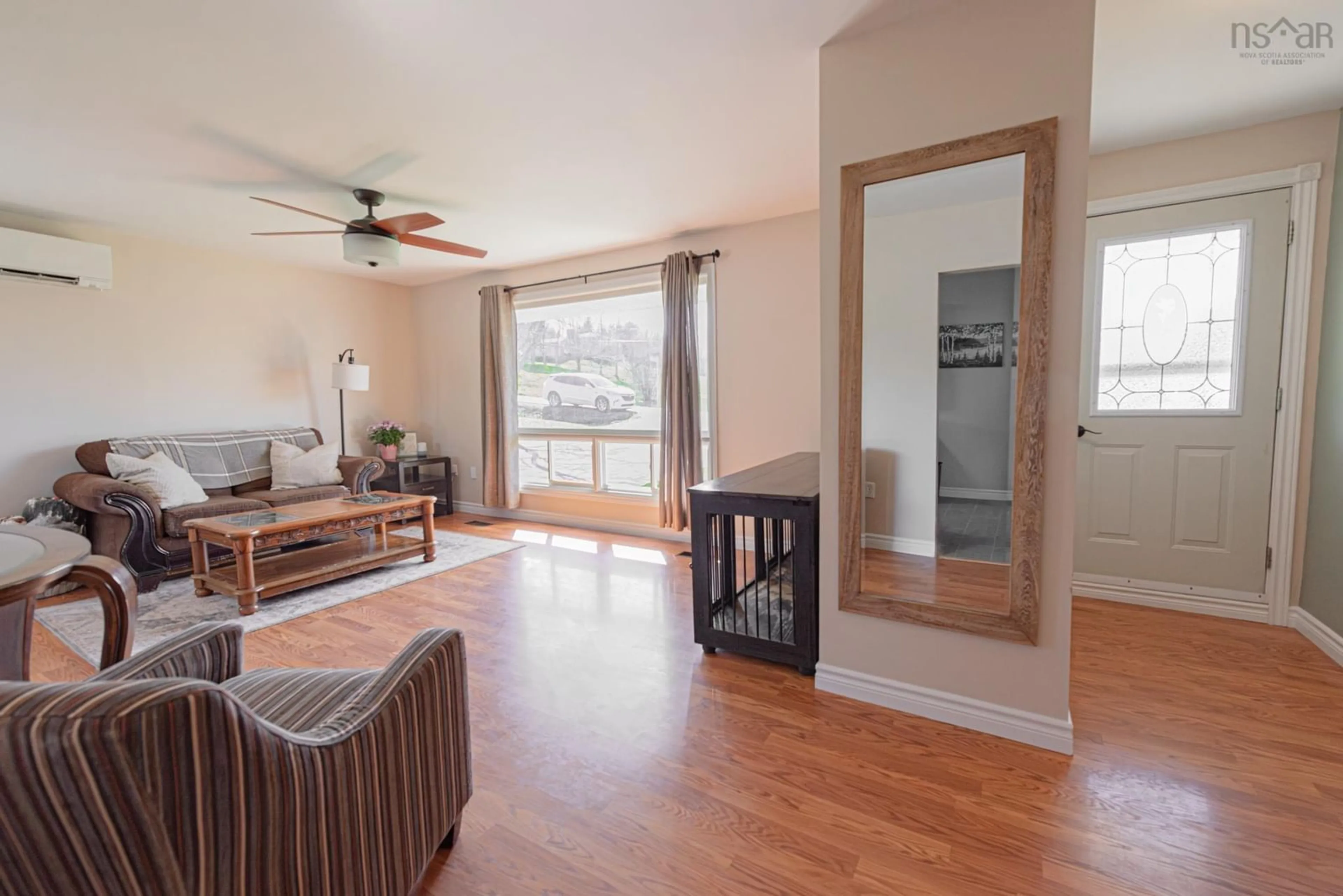 Living room with furniture, wood/laminate floor for 114 Mackenzie Rd, Mclellans Brook Nova Scotia B2H 5C7