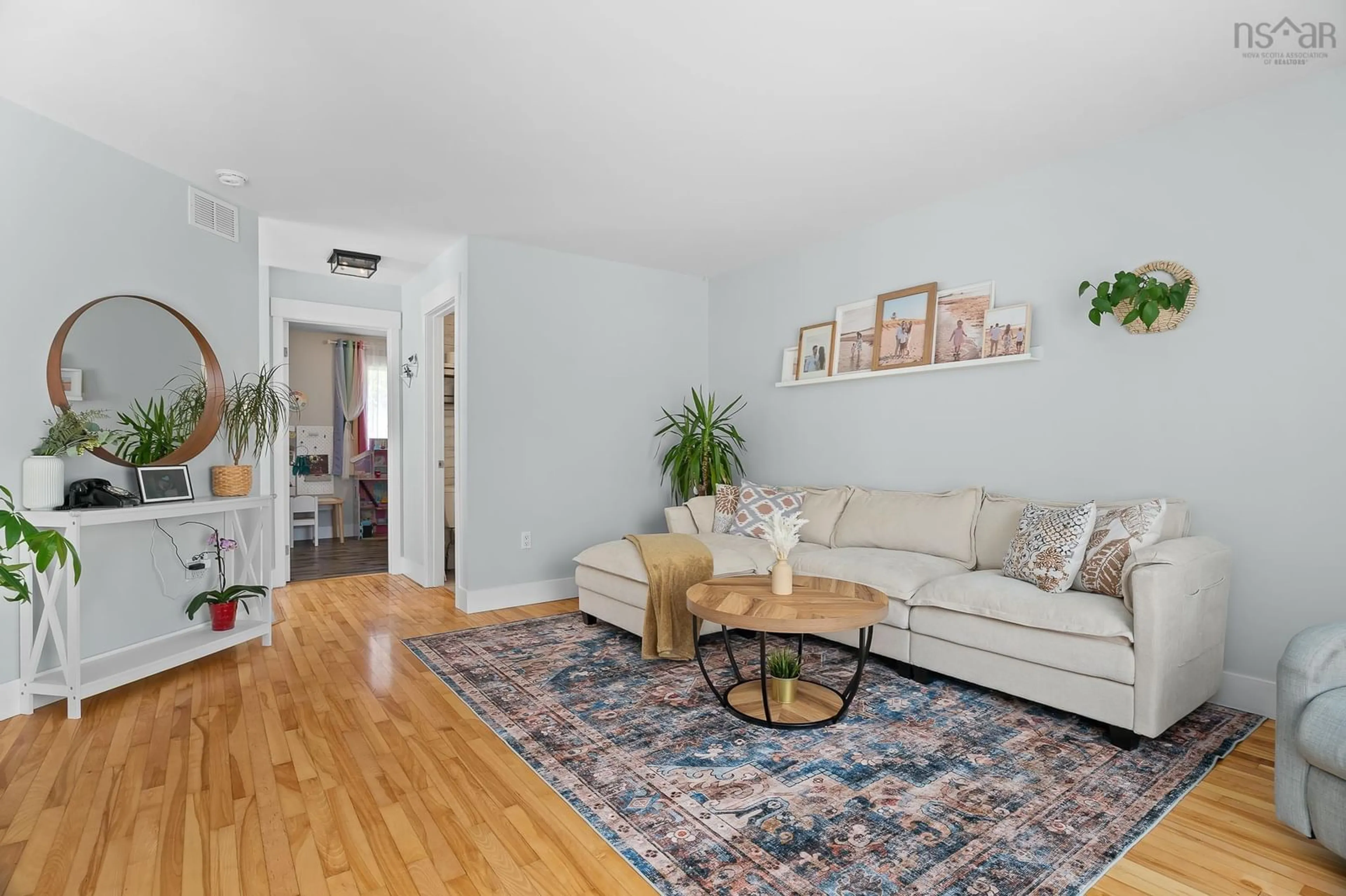 Living room with furniture, wood/laminate floor for 23 Sunnyvale Crt, Sackville Nova Scotia B4E 2T2