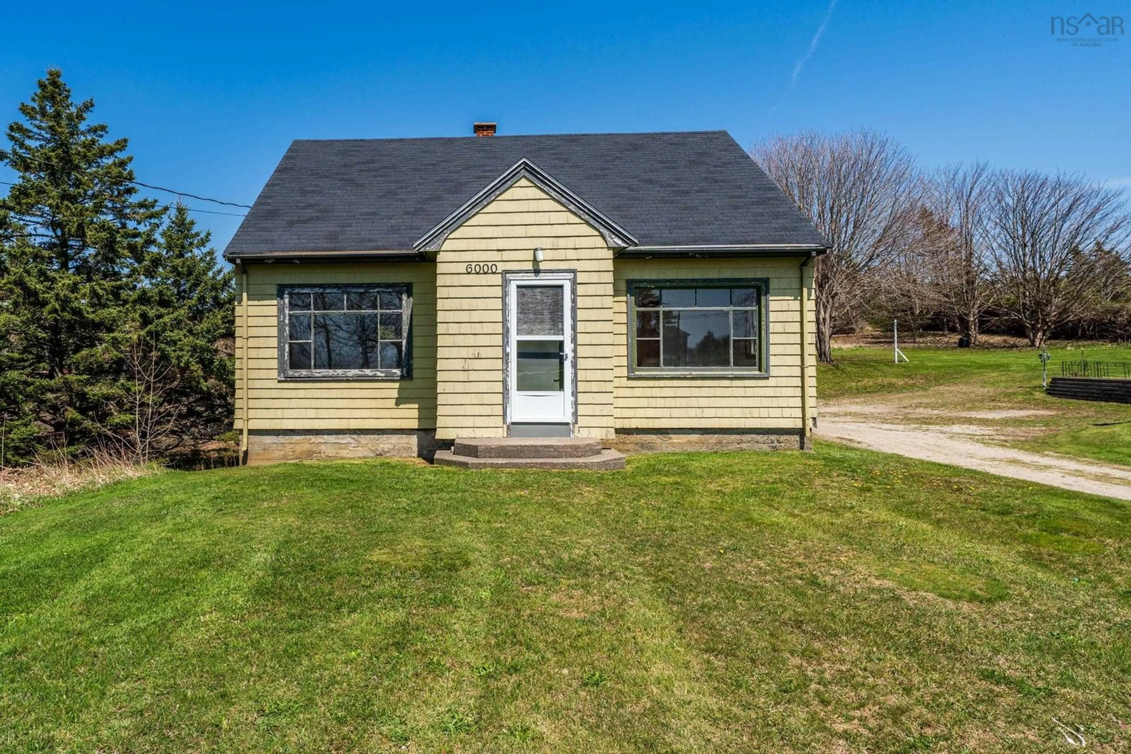 Home with vinyl exterior material, street for 6000 Highway 1, Mavillette Nova Scotia B5A 5B3